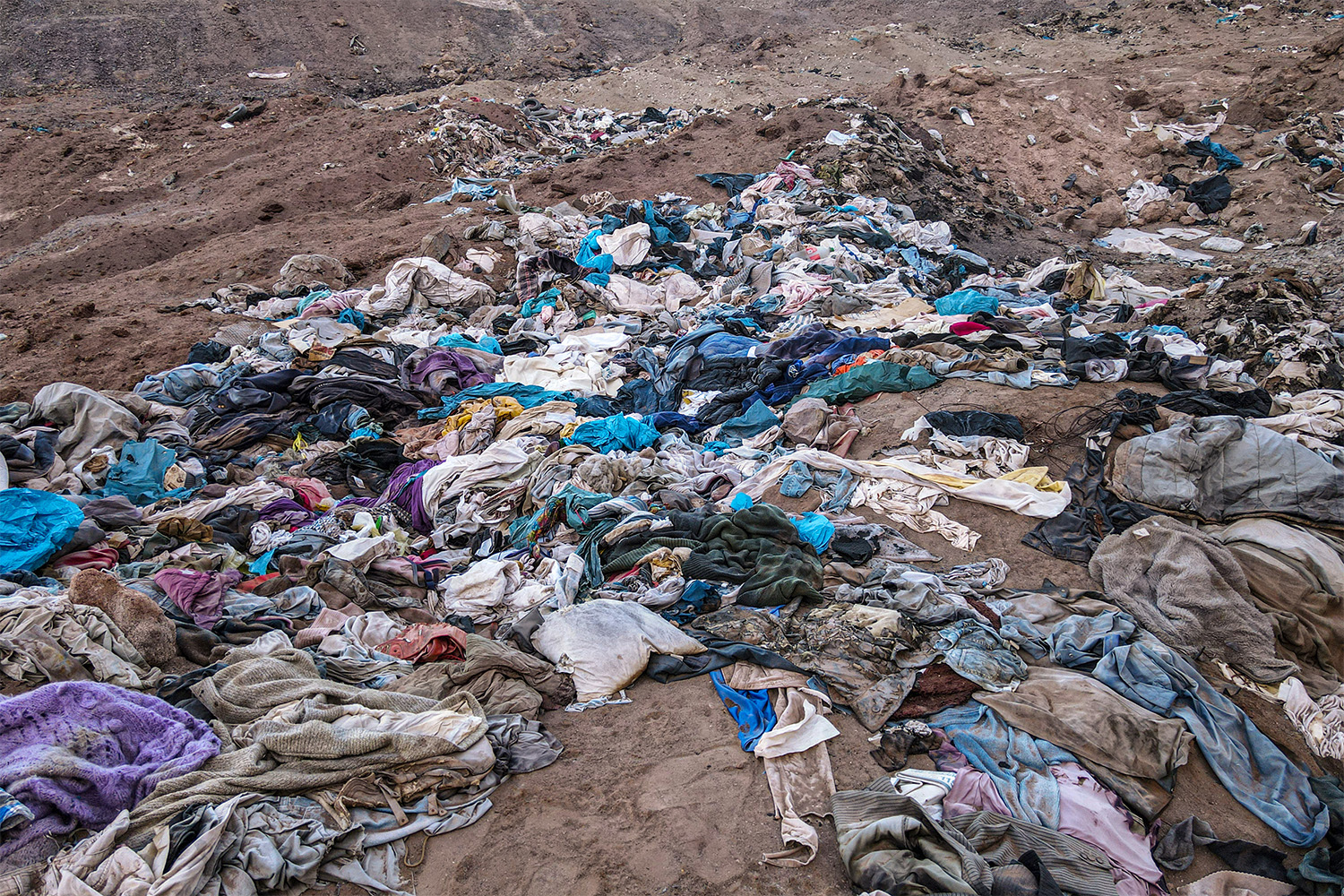 Fabric pieces and clothes in Atacama Desert, in Alto Hospicio, Chile in 2023. The La Pampa region is threatened with environmental pollution due to thousands of tons of plastic waste, garbage textiles and rubble piles. Photo / Getty Images