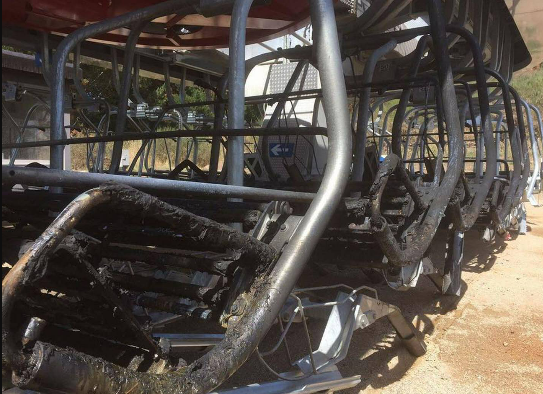 Charred remains of the chairlift seats from the 2017 fire.