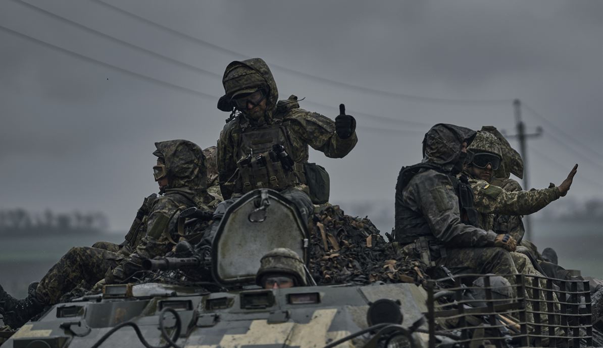 Ukrainian servicemen ride atop by an APC towards frontline positions near Vuhledar, Donetsk region, Ukraine. Photo / AP