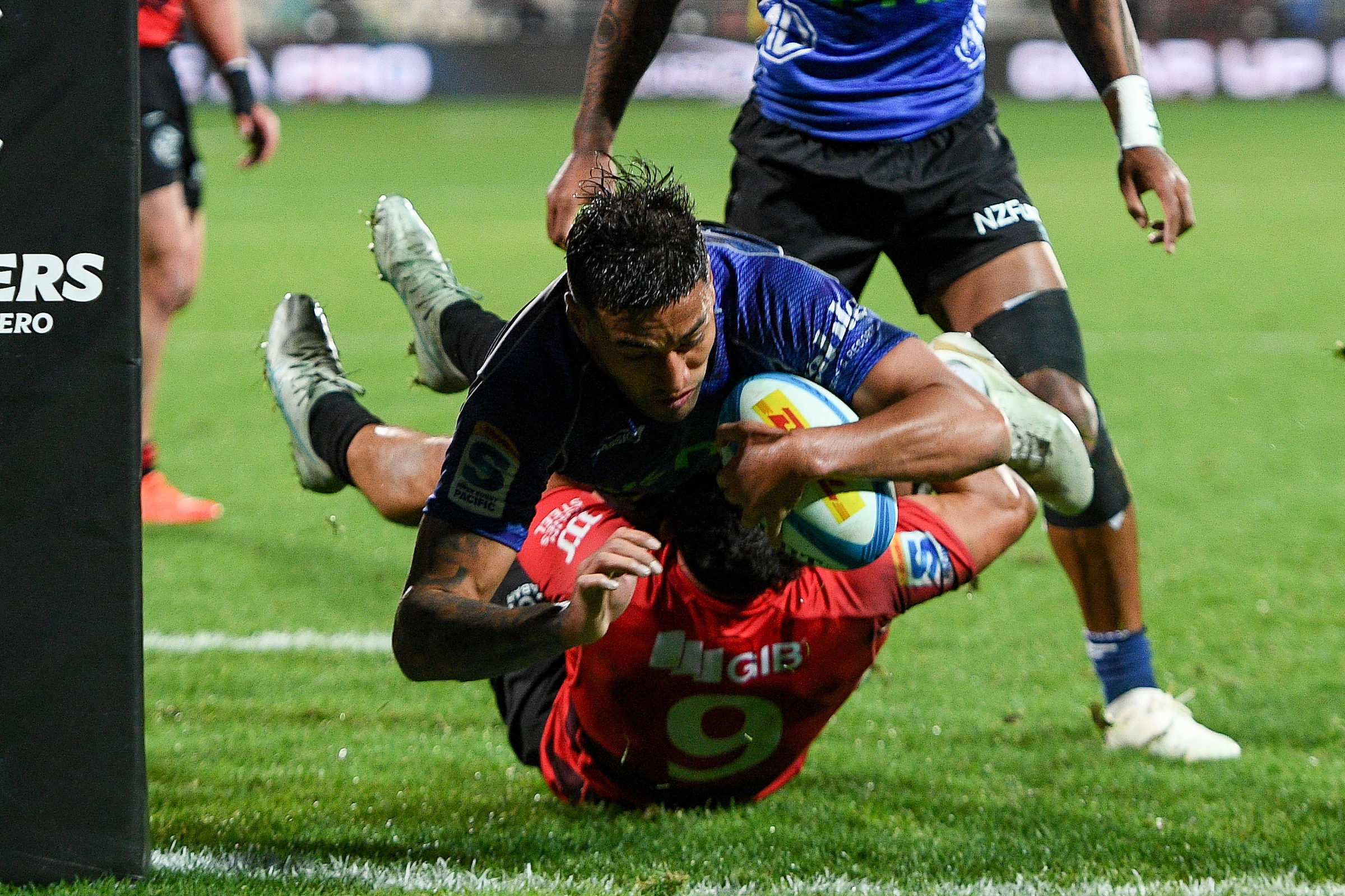 Rieko Ioane of the Blues scores a try in the tackle of Noah Hotham during the Super Rugby semifinal in Christchurch. Photo / Photosport