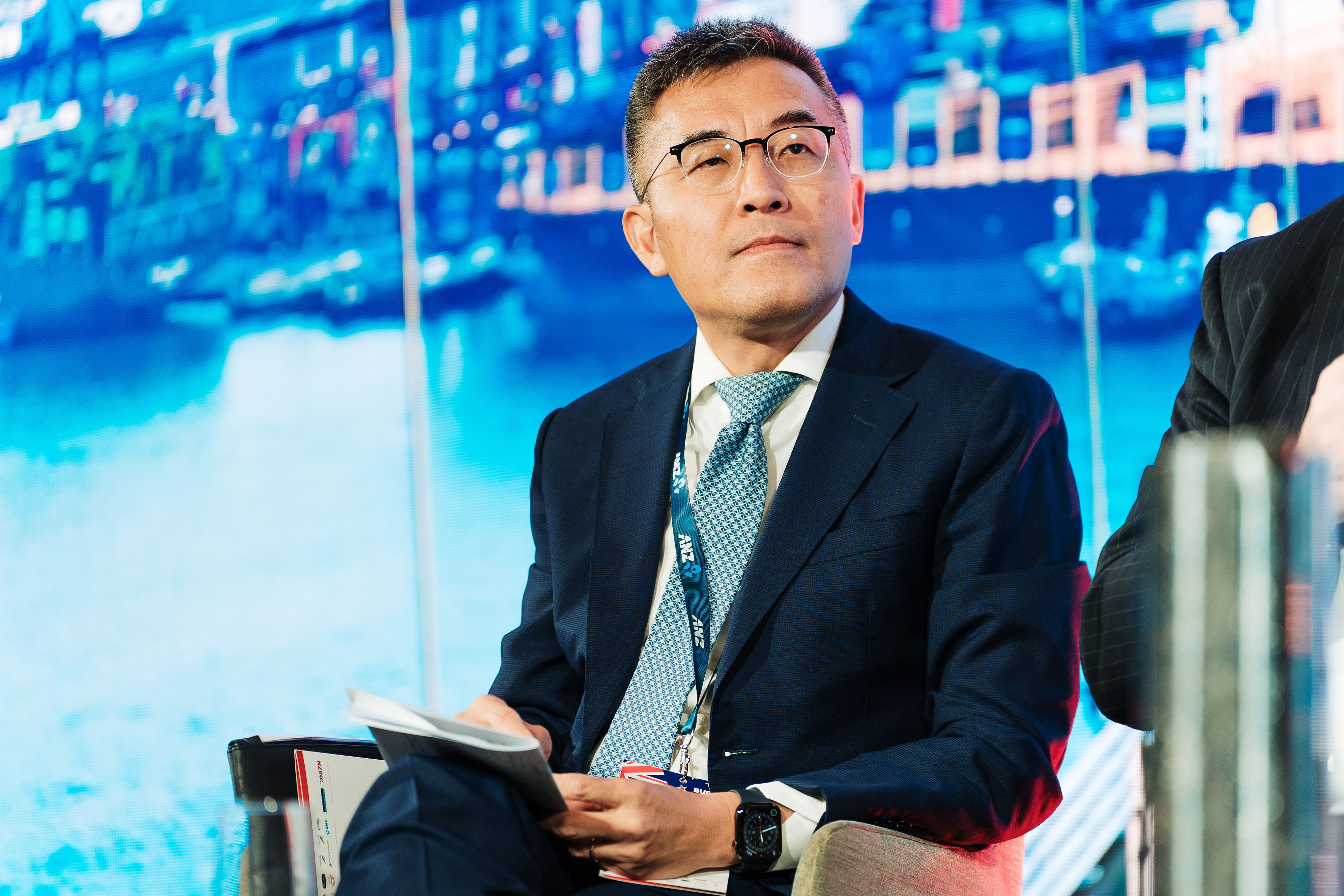 Andrew Tan speaking in Auckland in 2023.