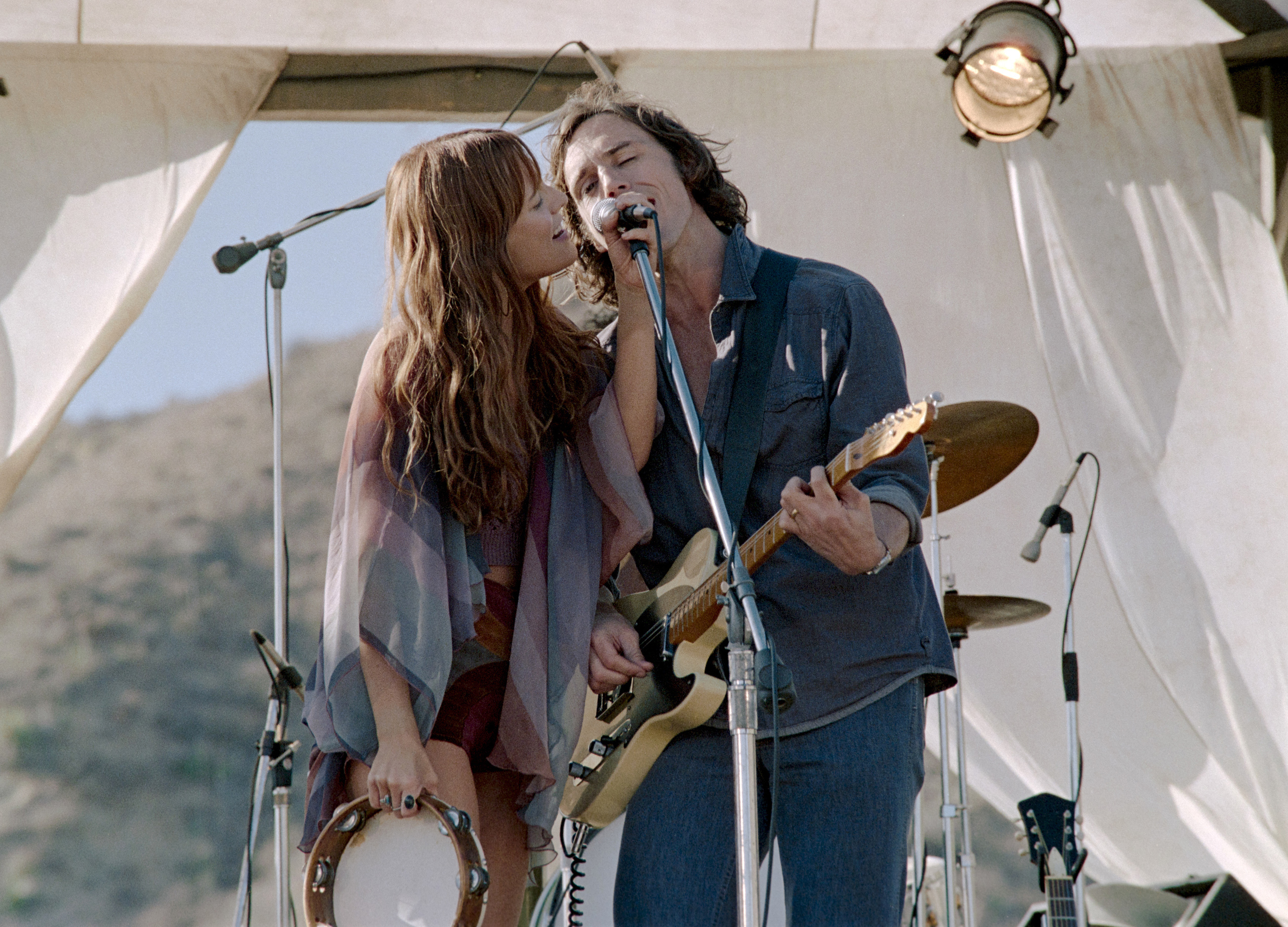 Sam Claflin, right, and Riley Keough in a scene from Daisy Jones & The Six. Photo / AP