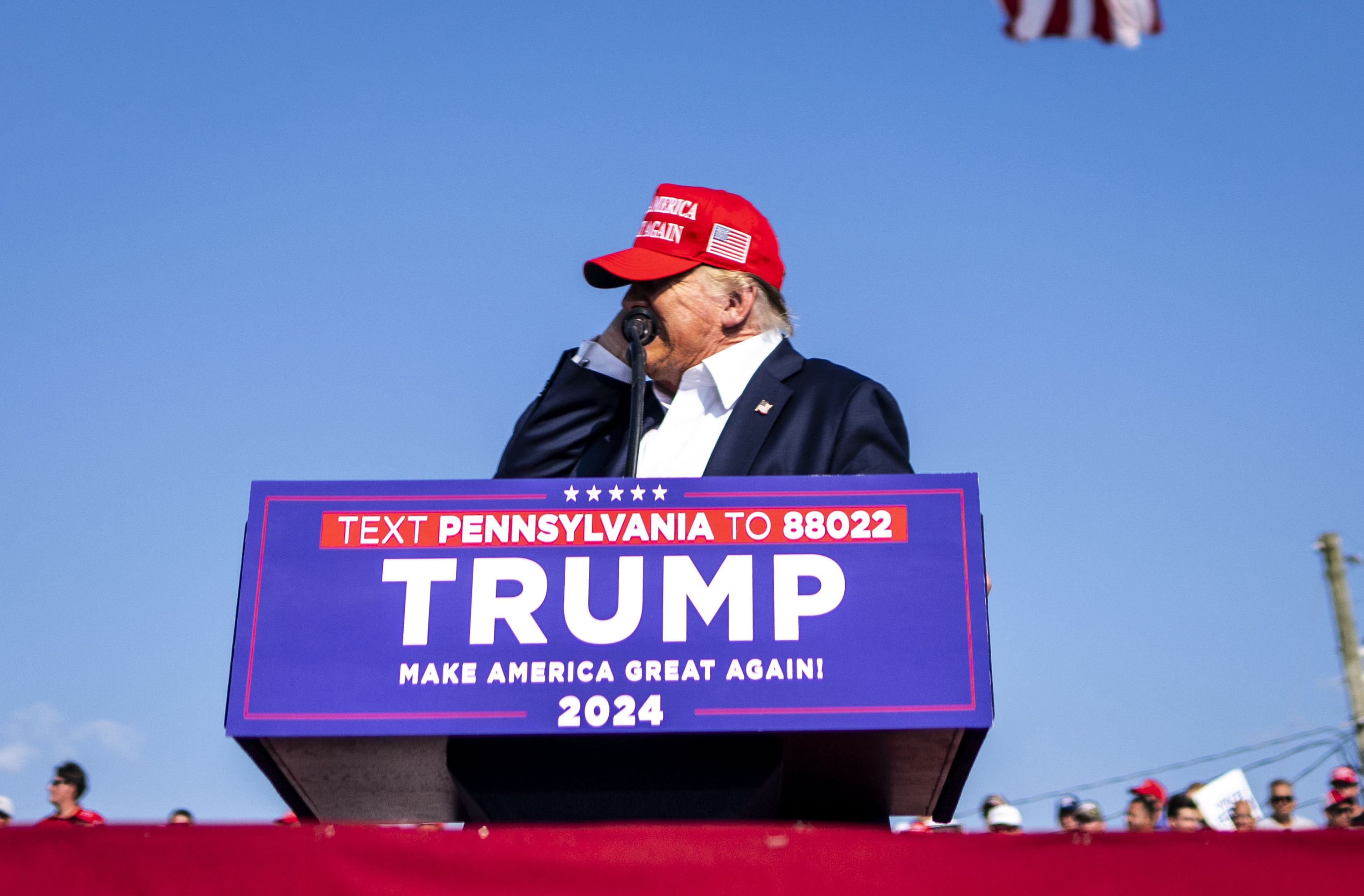 Former President Donald Trump touches his ear after a bullet grazed him in a shooting at his campaign rally in Butler, Pennsylvania. Photo / Doug Mills, The New York Times