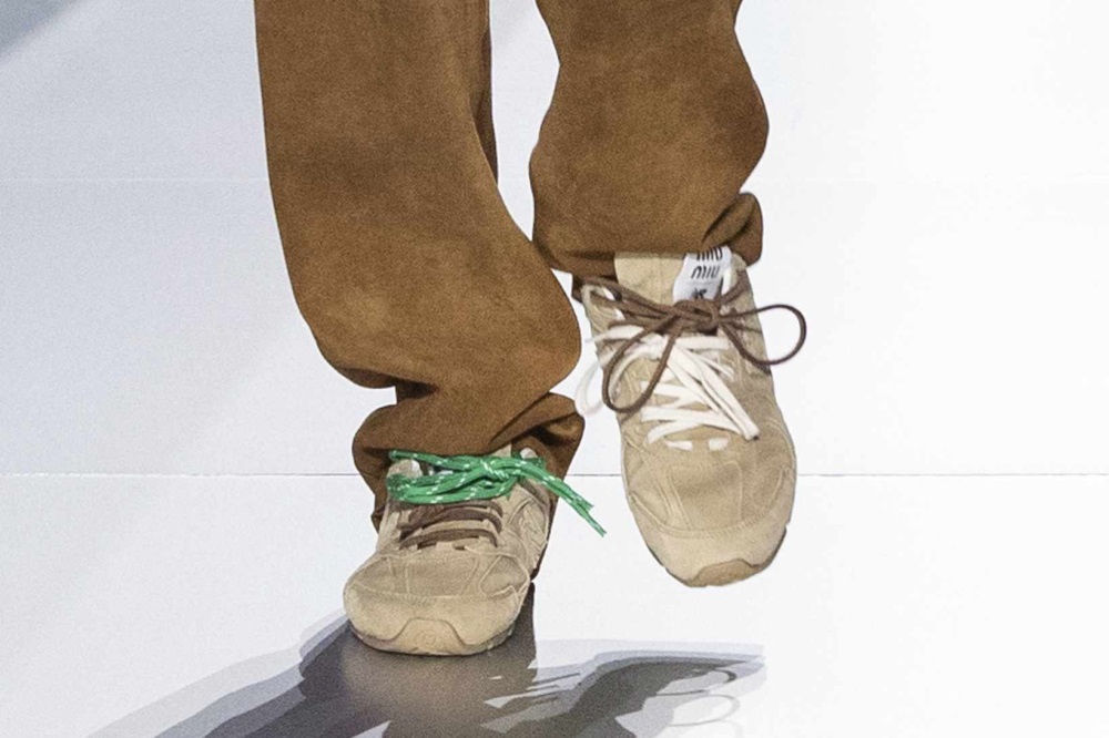 New Balance x Miu Miu suede sneakers with contrasting shoelaces from a spring/summer 2024 collection.