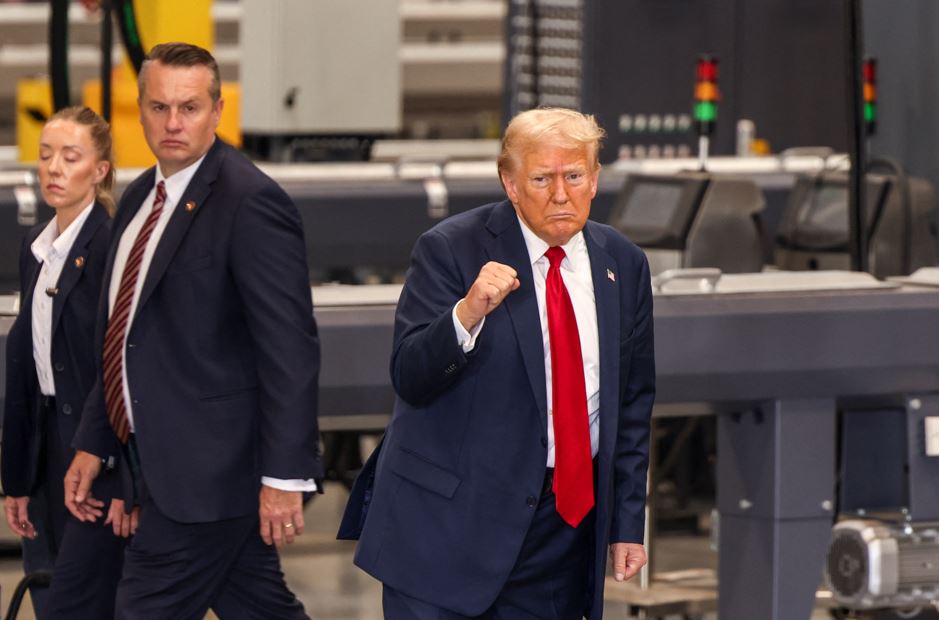 Former US President and Republican presidential candidate Donald Trump gestures as he departs after concluding his remarks during a campaign event in North Carolina earlier today. Photo / AFP)