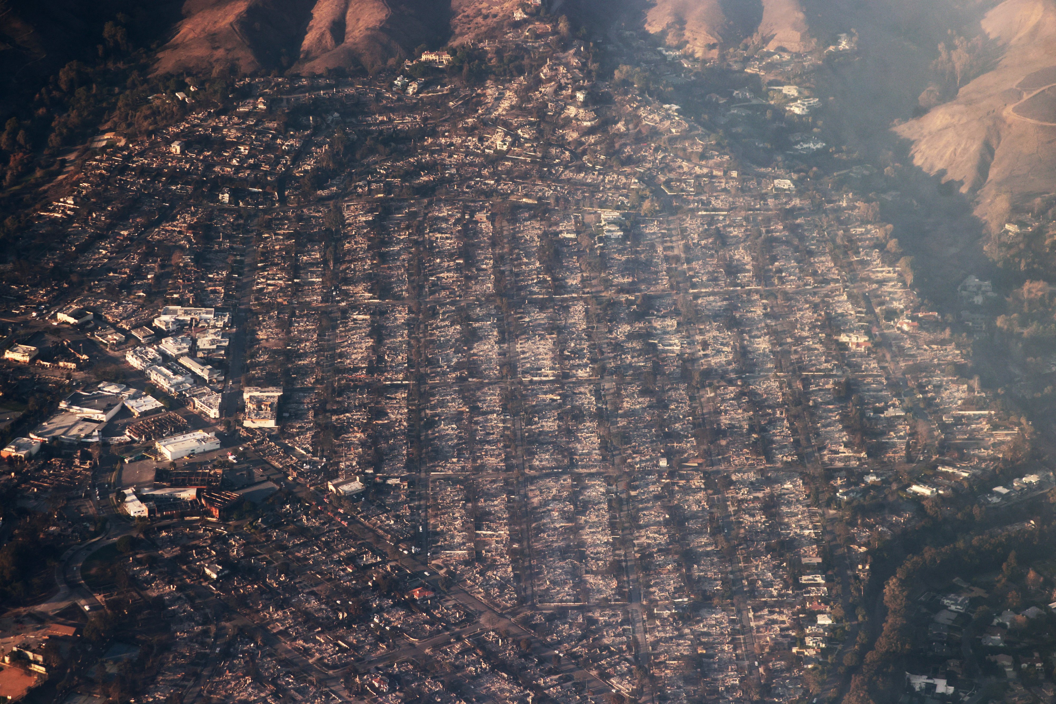This aerial photo shows homes and businesses reduced to smouldering rubble by the Palisades fire in the Pacific Palisades neighbourhood of Los Angeles. Photo / AFP