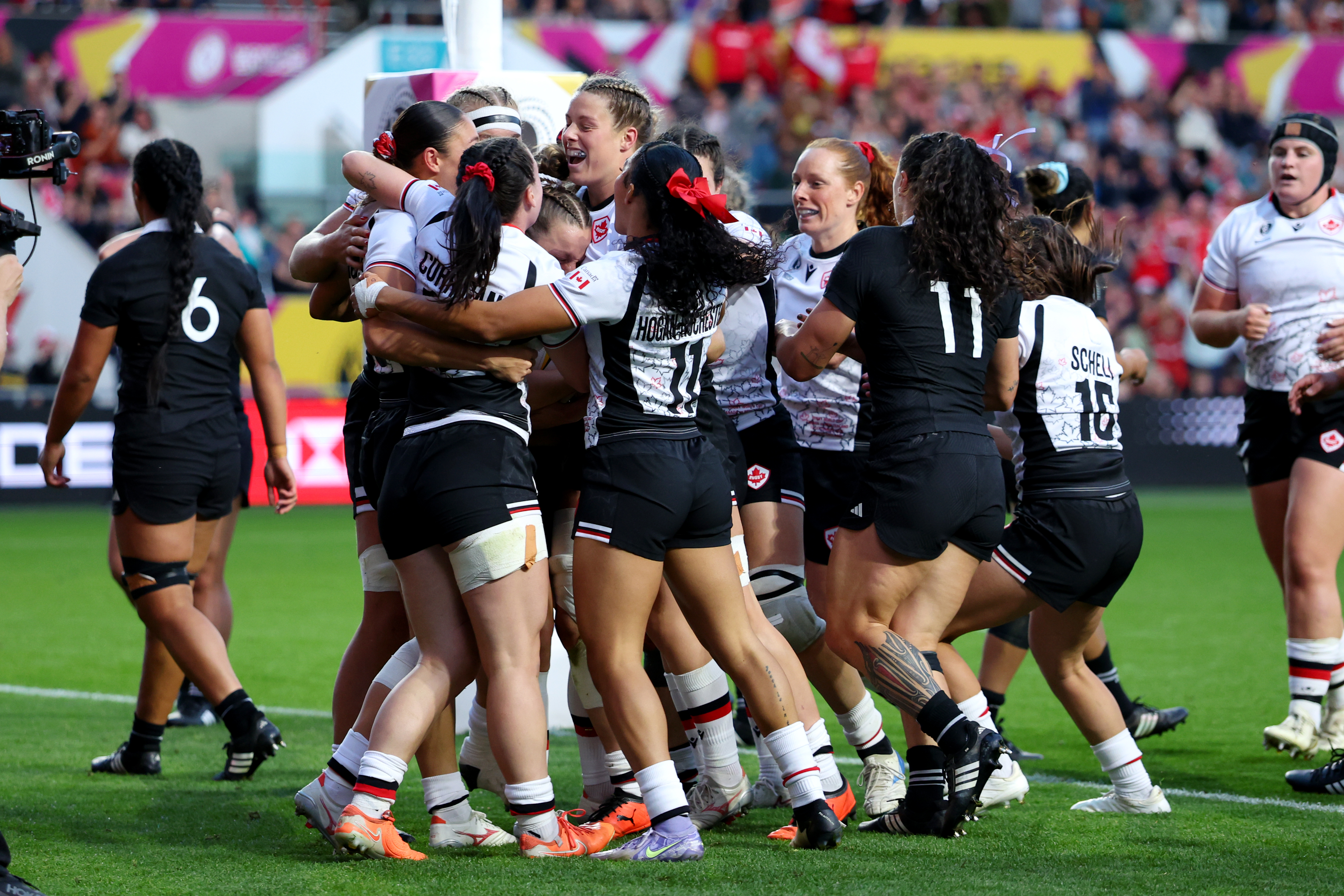 Justine Pelletier of Canada celebrates with teammates after scoring in the Women's Rugby World Cup semifinal against the Black Ferns at Ashton Gate. Photo / Getty Images