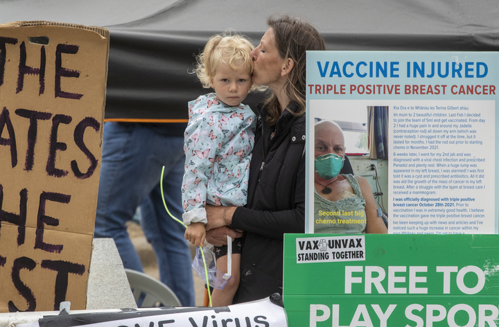 A protester kisses a child at the Parliament occupation. Photo / Mark Mitchell
