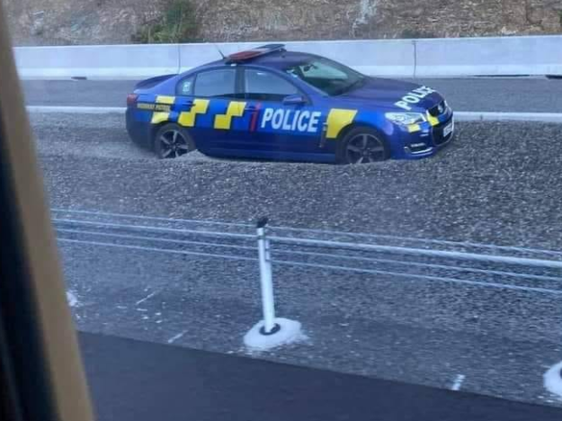 This police car discovered the gravel pit works.