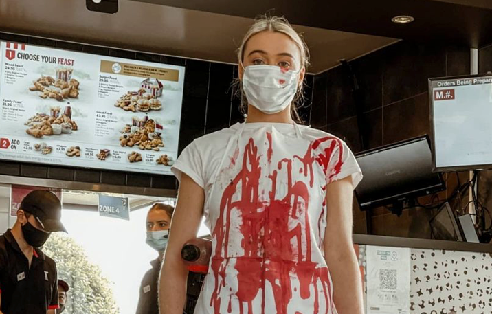 Perth vegan activist Tash Peterson disrupts KFC patrons with latest animal  rights protest