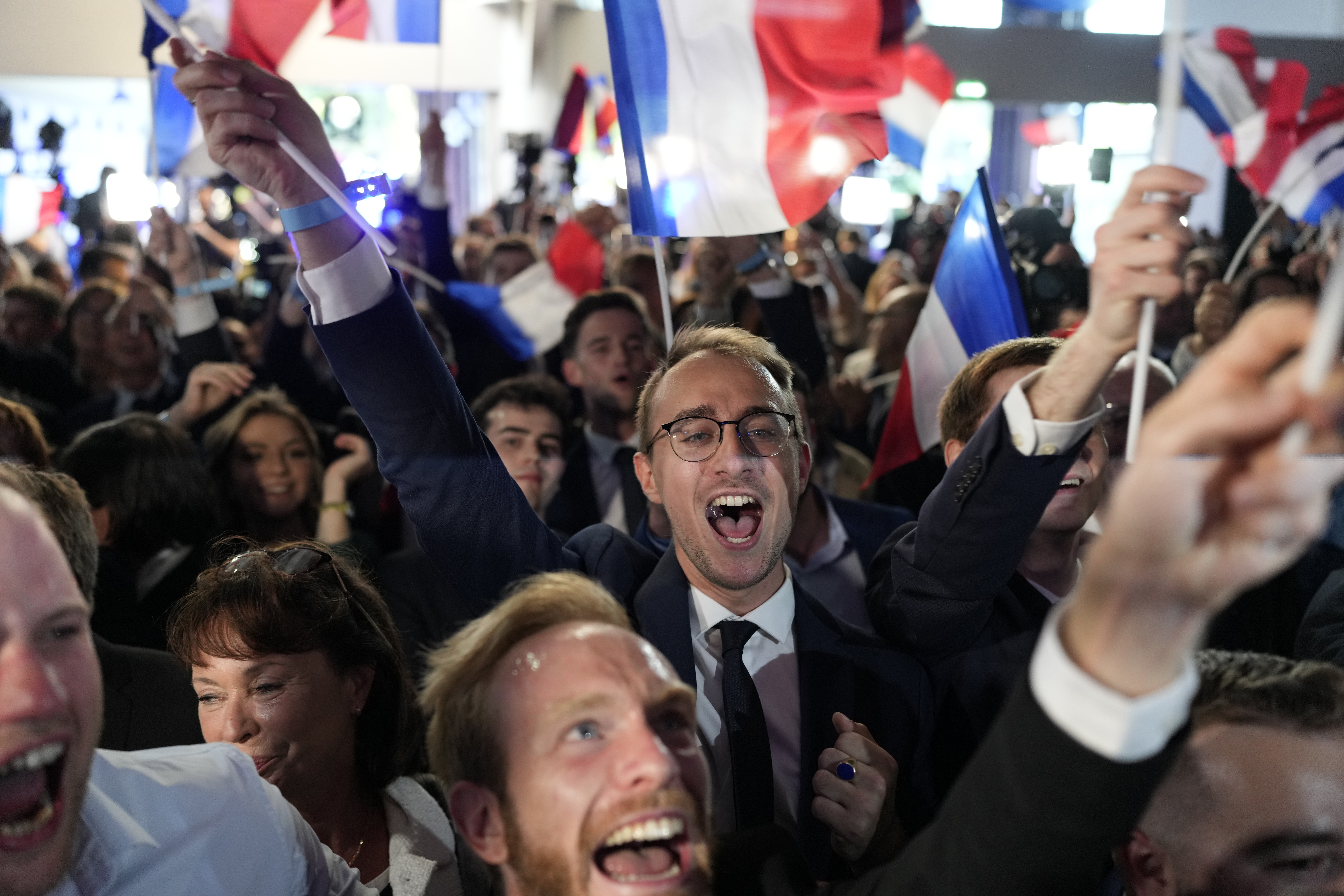Supporters of French far-right party National Rally react at the party's election night headquarters on Sunday, June 9, 2024 in Paris. First projected results from France put the far-right National Rally party well ahead in EU elections, according to French opinion poll institutes. AP Photo / Lewis Joly
