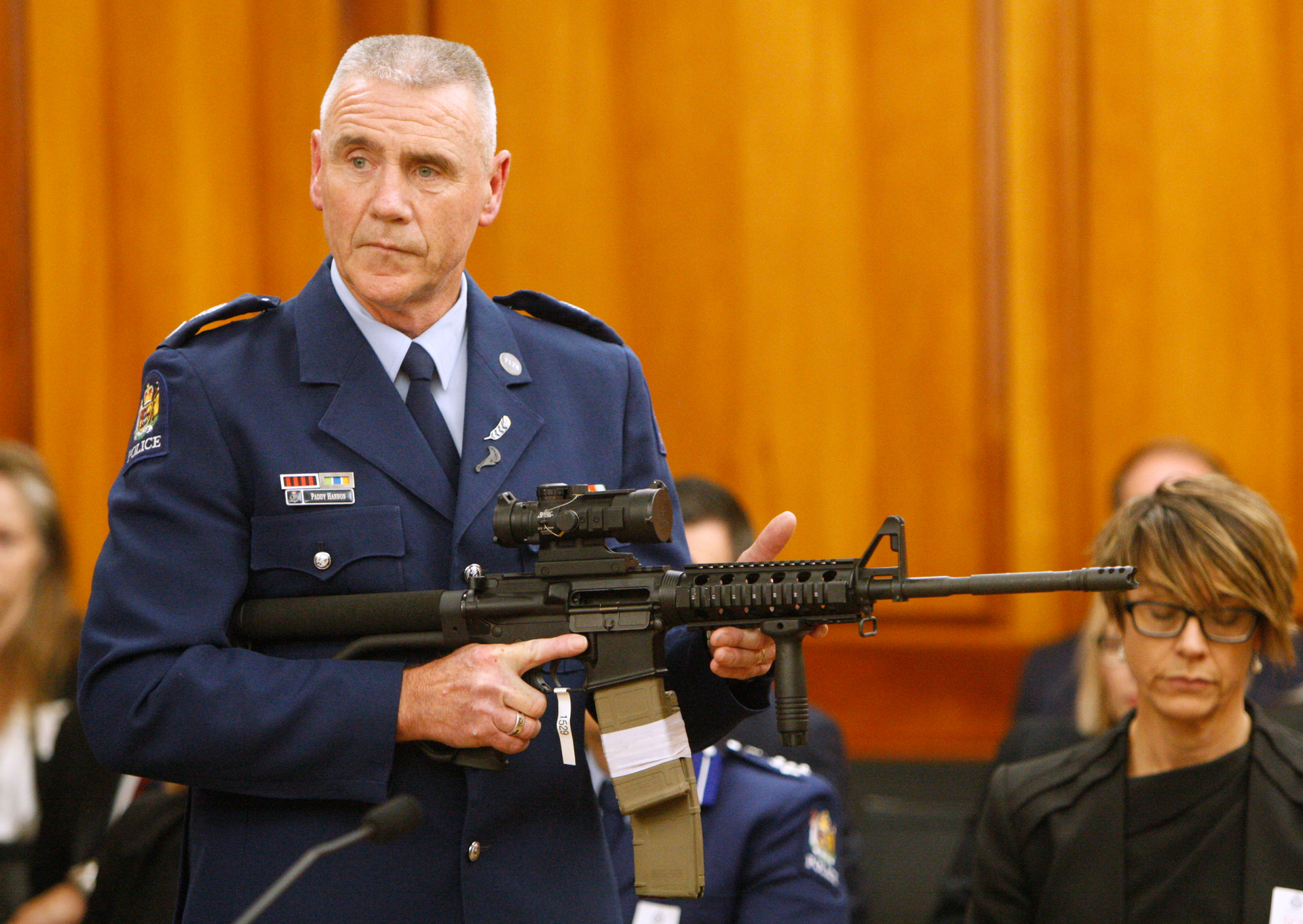 Police Senior Sergeant Paddy Hannan shows New Zealand lawmakers an AR-15 style rifle. Photo / File