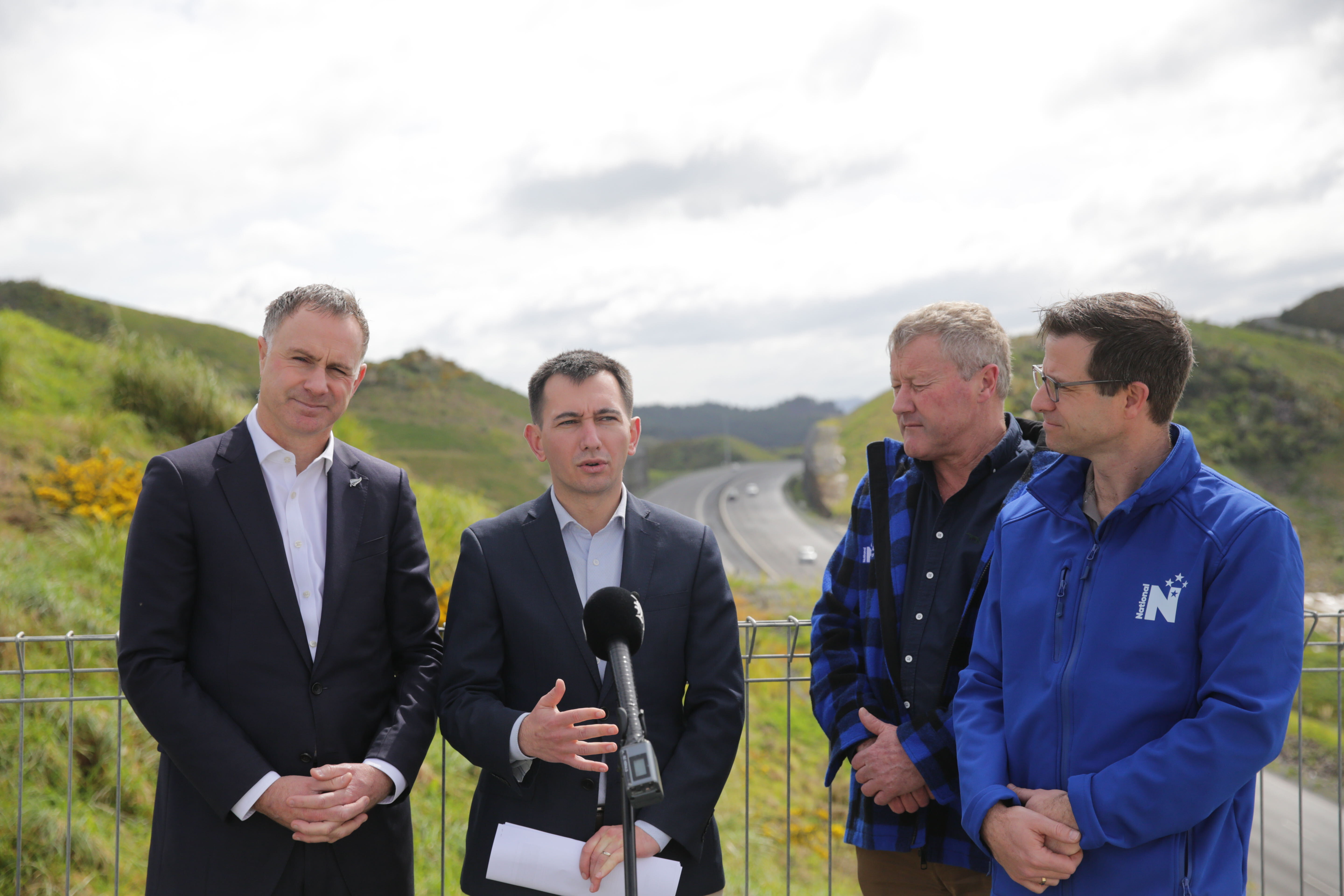 Transport Minister Simeon Brown (second left) held a press conference near Warkworth today to announce the proposal. Photo / Sylvie Whinray