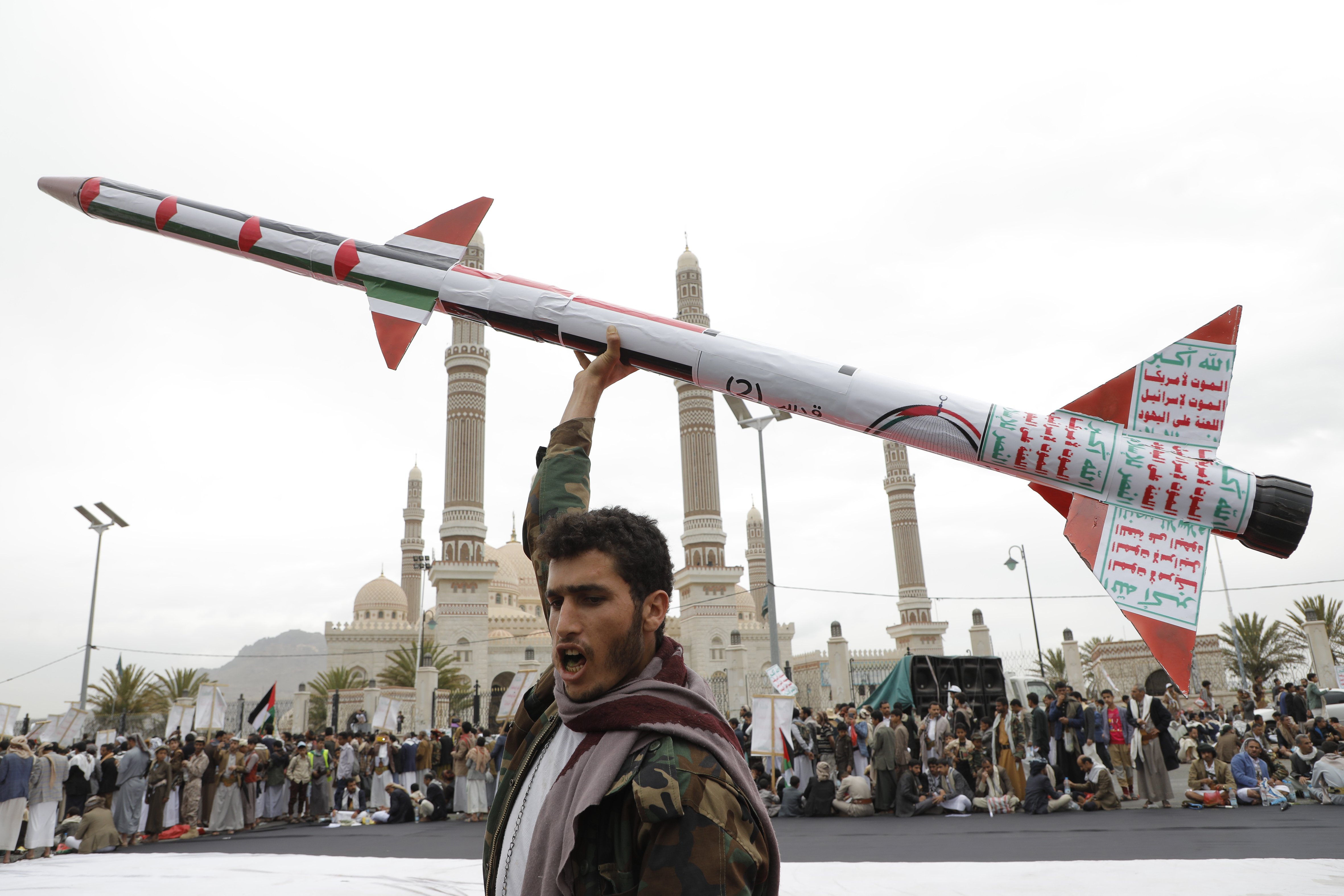 A Houthi supporter raises a mock rocket during a rally against the US and Israel and in support of Palestinians in the Gaza Strip, in Sanaa, Yemen. Photo / AP