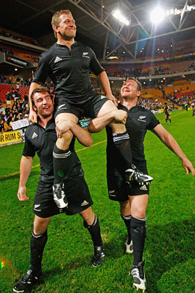 Greg Somerville is lifted by Andrew Hore and Tony Woodcock after a Tri-Nations and Bledisloe Cup victory over Australia in Brisbane. Photo / Getty Images