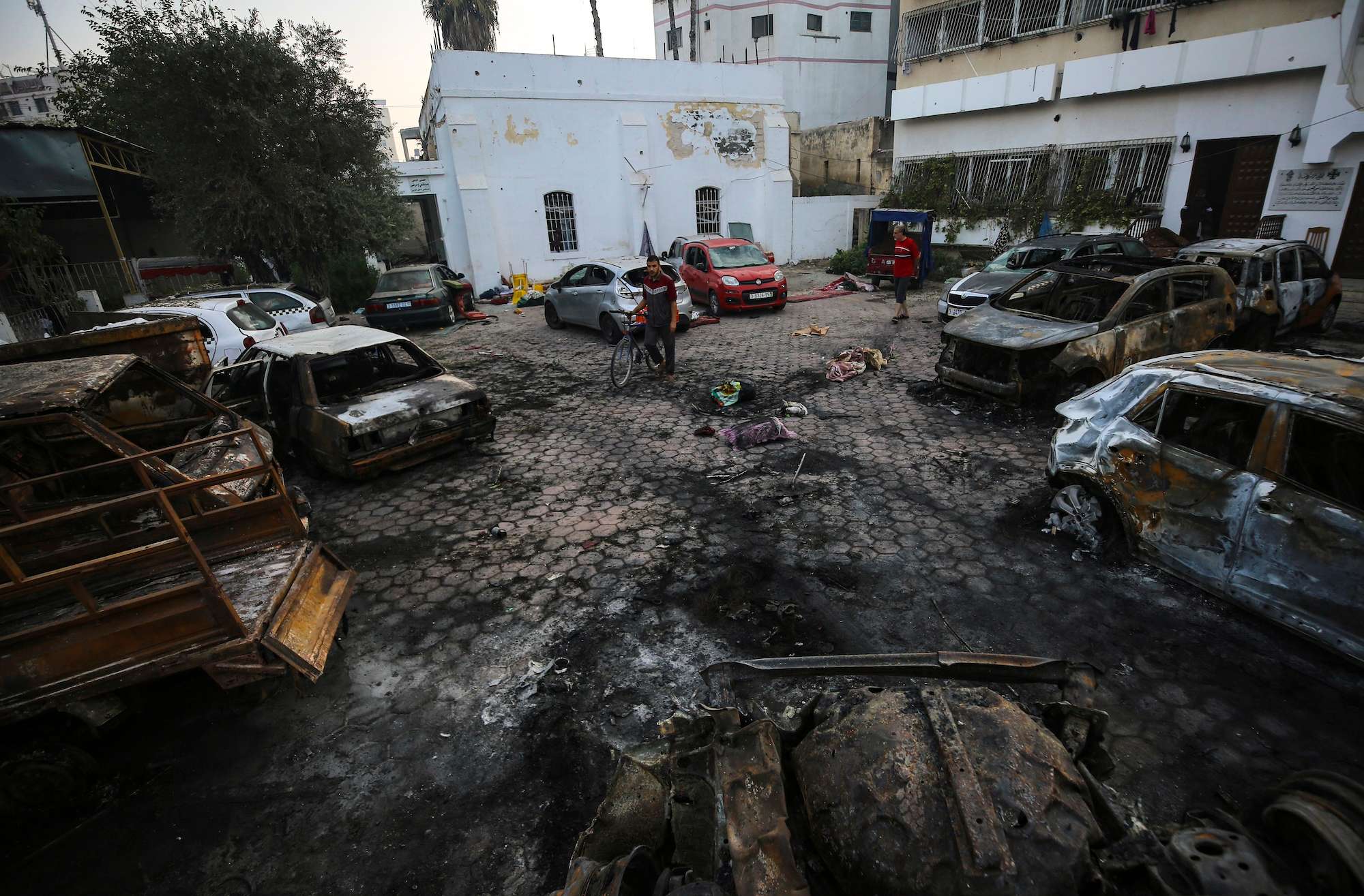 Palestinians check the site of a deadly explosion in al-Ahli hospital, in Gaza City. Photo / AP