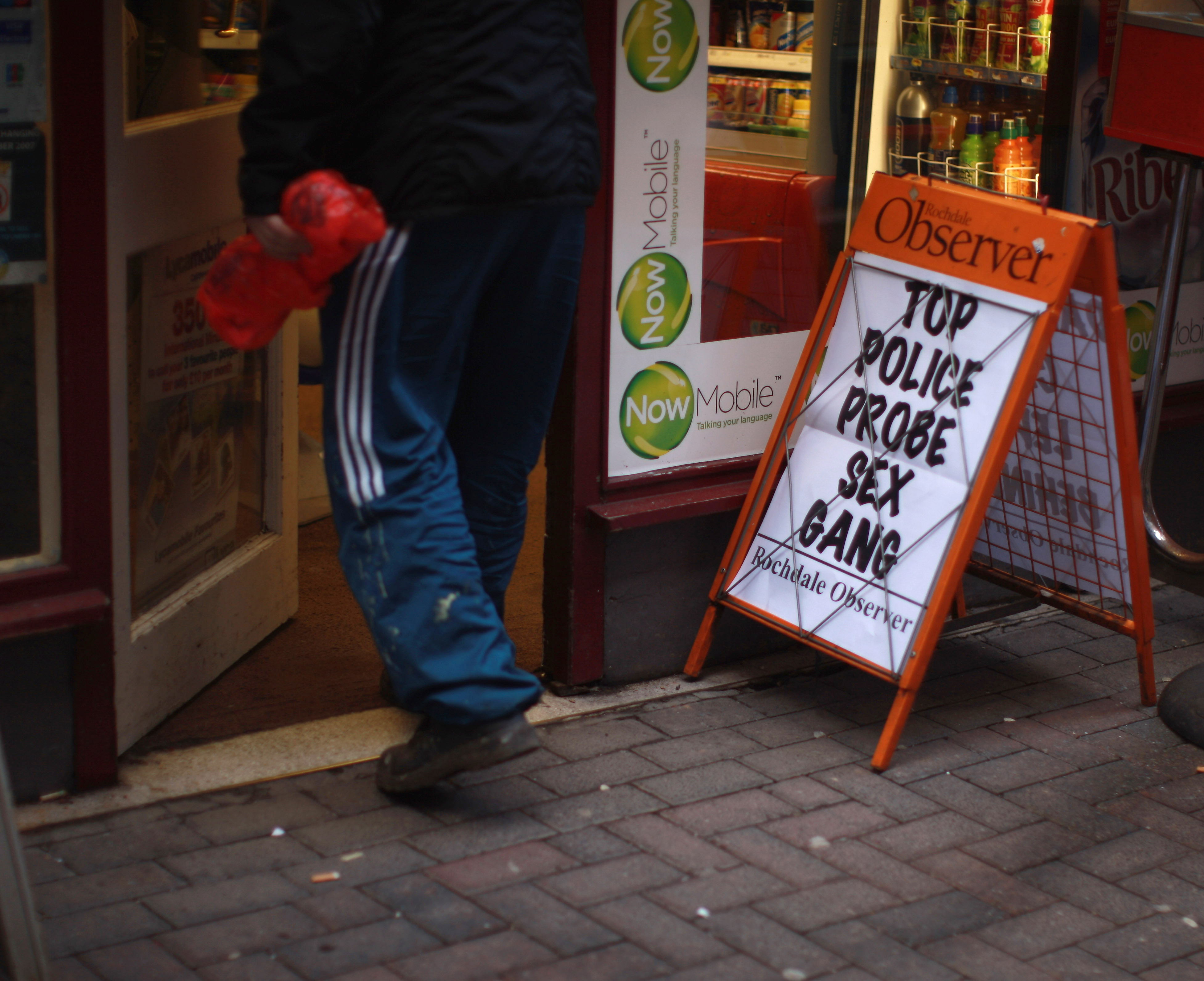 A newspaper advertising board outside a corner shop in the Lancashire town of Rochdale after nine men were arrested for child sexual exploitation on January 11, 2011. Photo / Getty