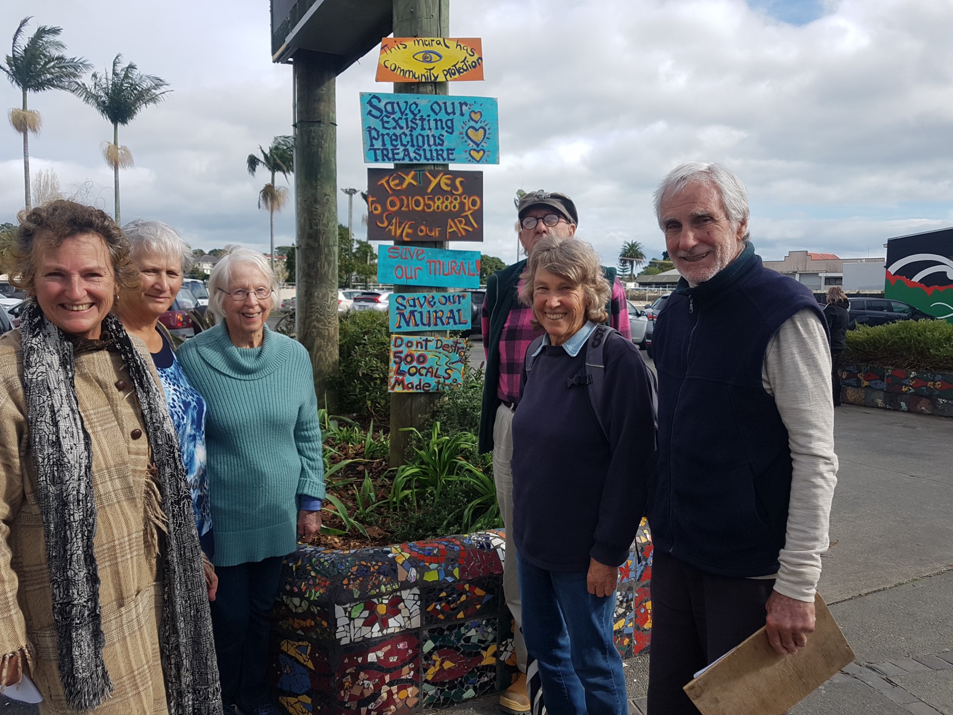 Artist Jen Gay (left) and supporters who started a petition to save the mosaic tile wall in Kaitāia.