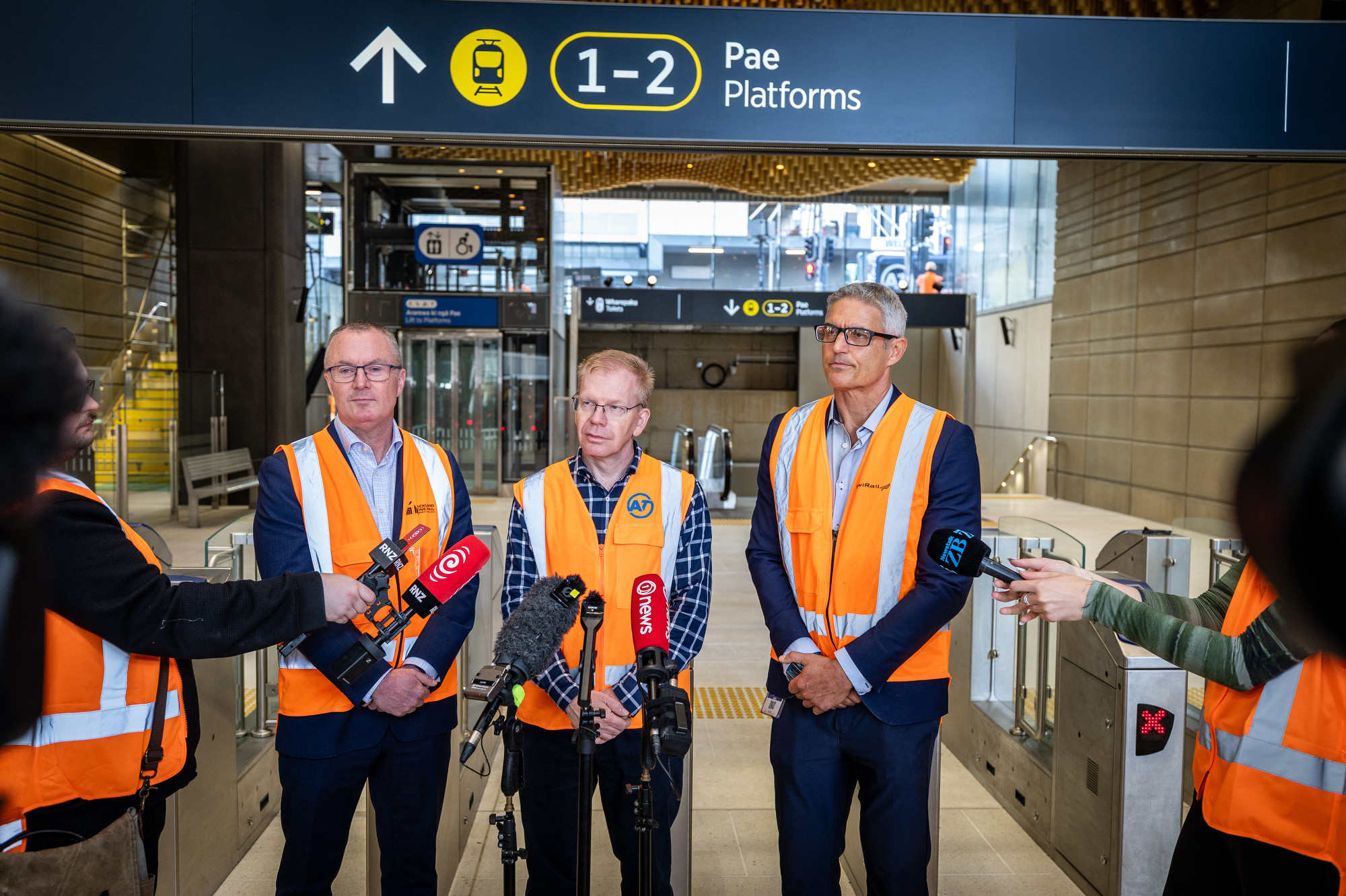 Auckland One Rail CEO Martin Kearney (left), AT group manager rail services Mark Lambert and KiwiRail CRL programme director Bevan Assink speak to media during the testing. Photo / Michael Craig