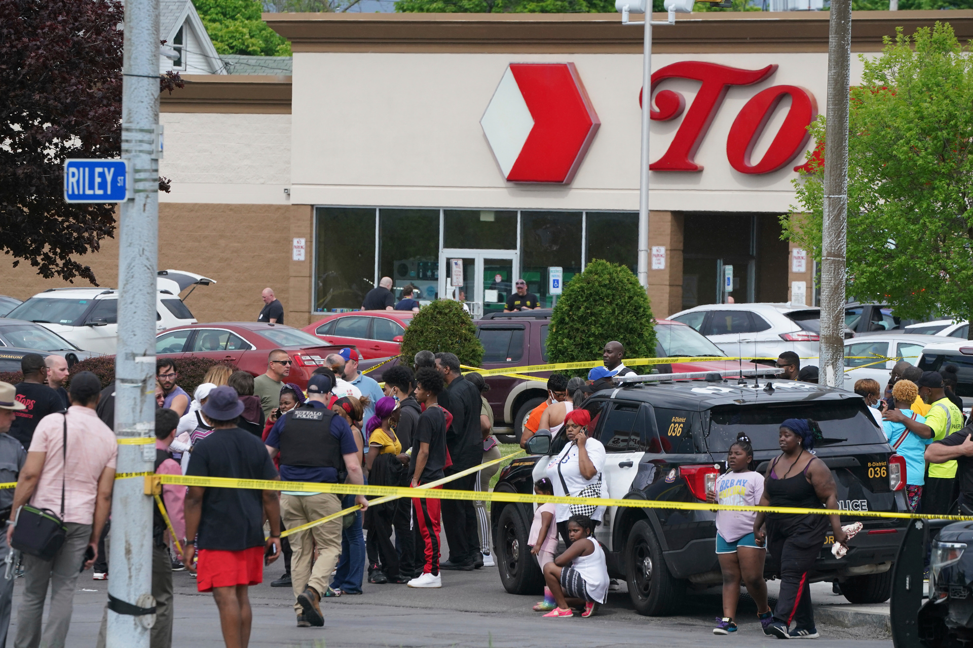 People gather outside a supermarket where several people were killed in a shooting in Buffalo, New York. Photo / AP