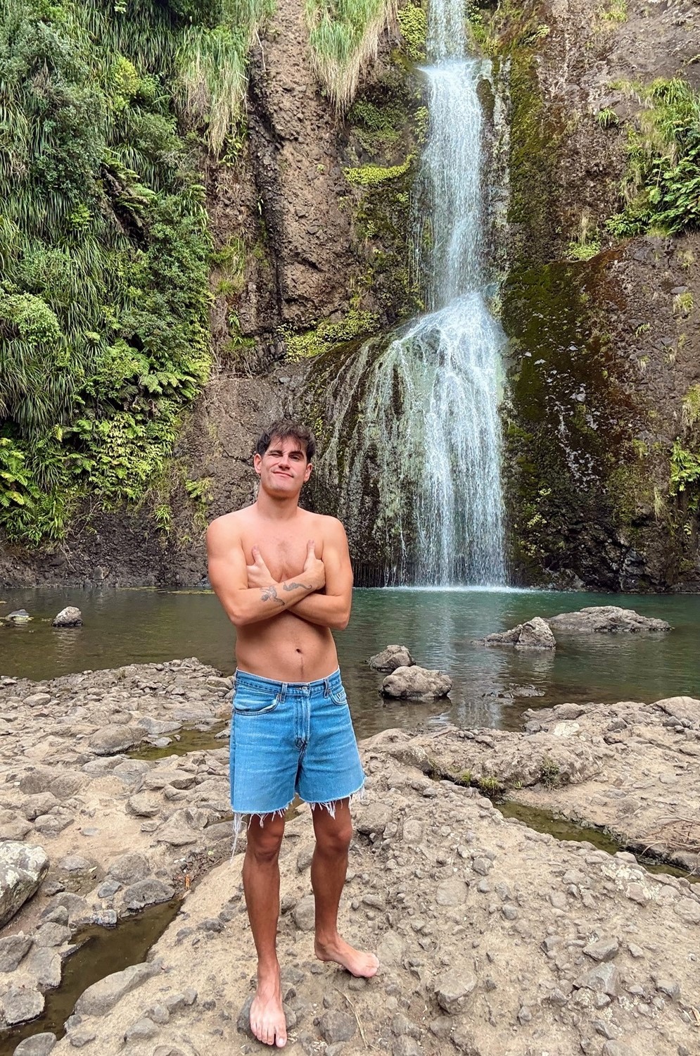 Chilling out at Kitekite Falls during a recent trip home to Aotearoa. Photo / @kieltutin