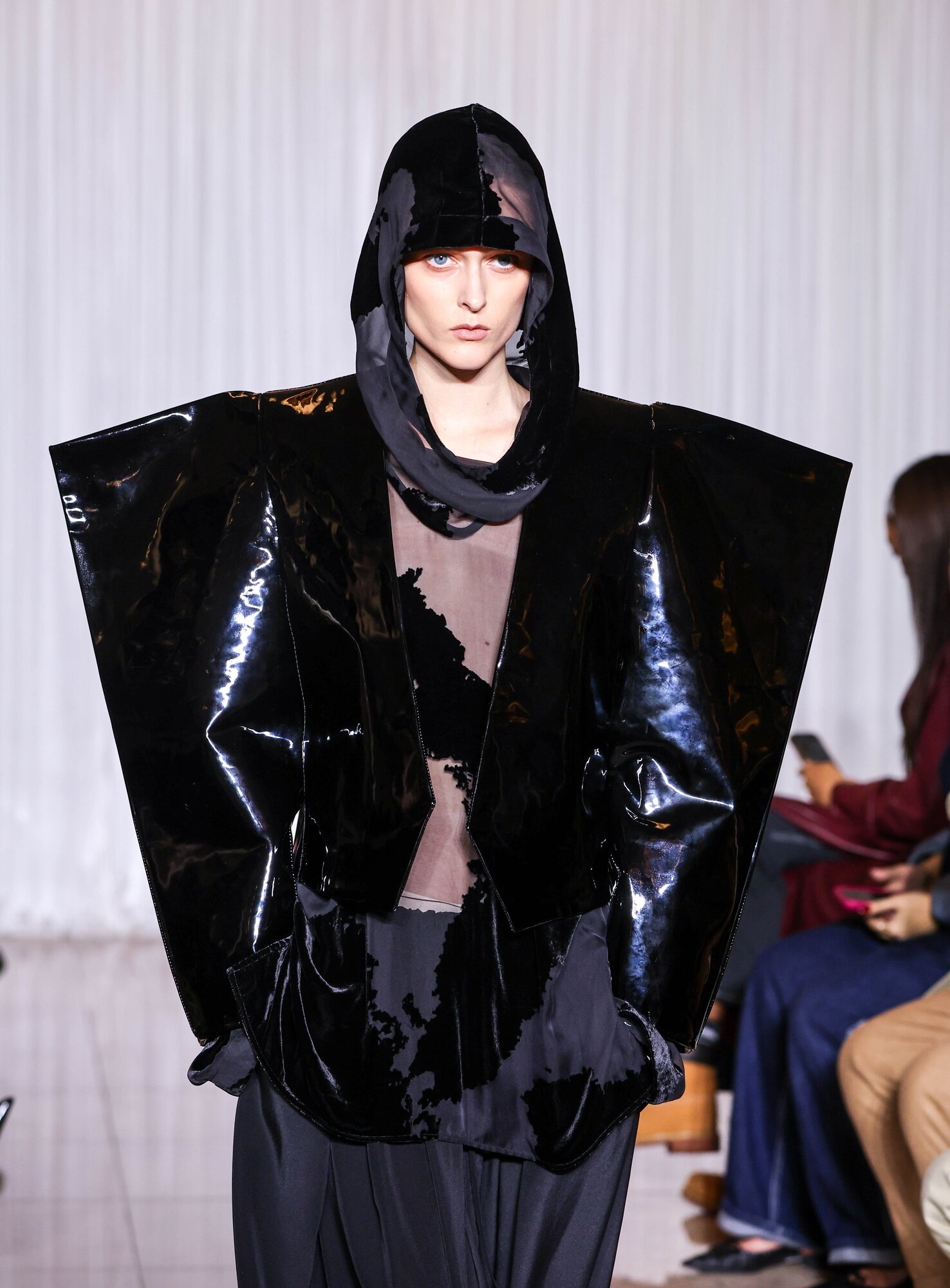 A high impact look from Rory William Docherty's London Fashion Week debut, featuring high-shine material and hood. Photo / Getty Images