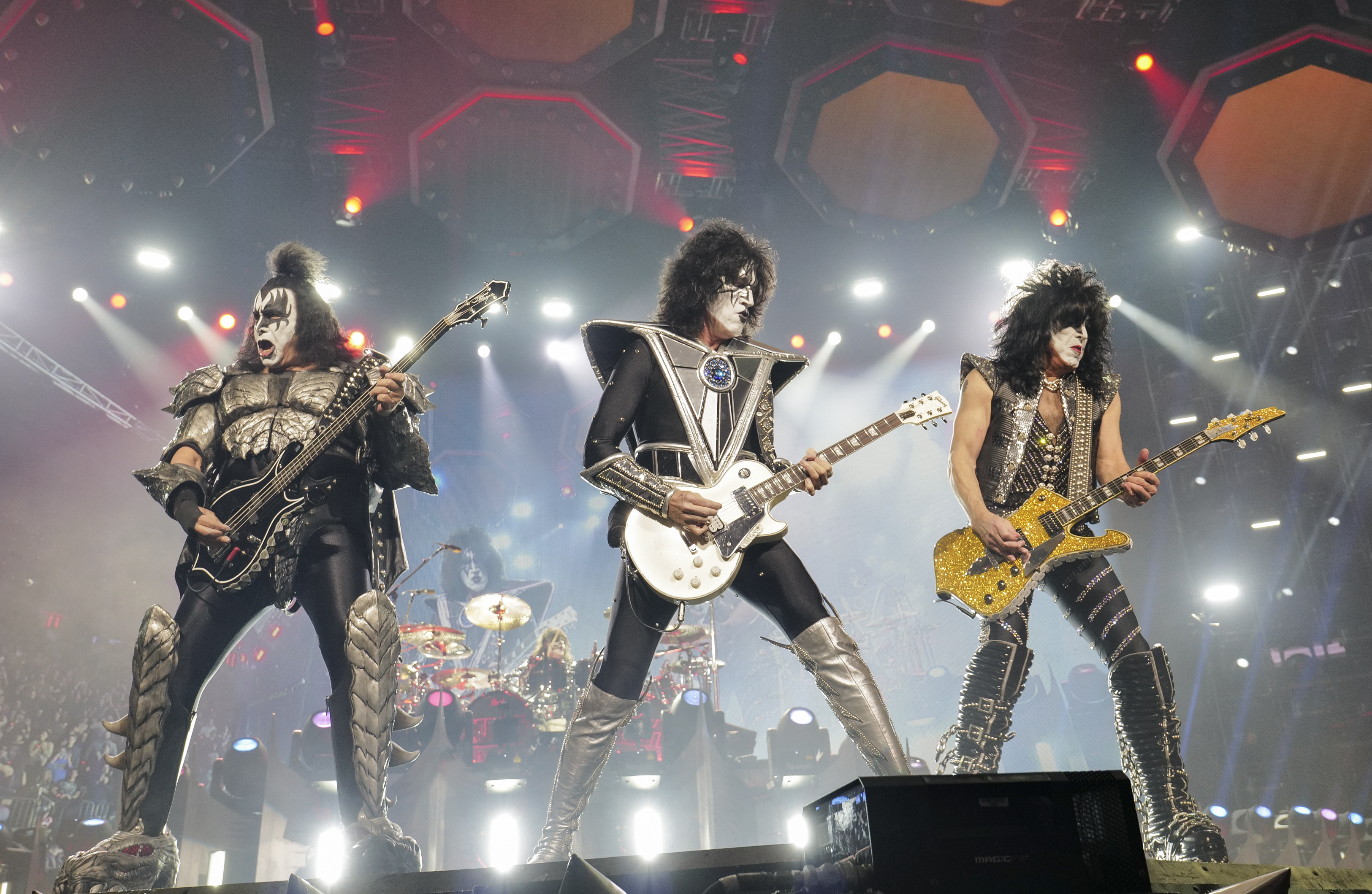 FILE - Gene Simmons, from left, Tommy Thayer, and Paul Stanley of KISS perform during the final night of the 