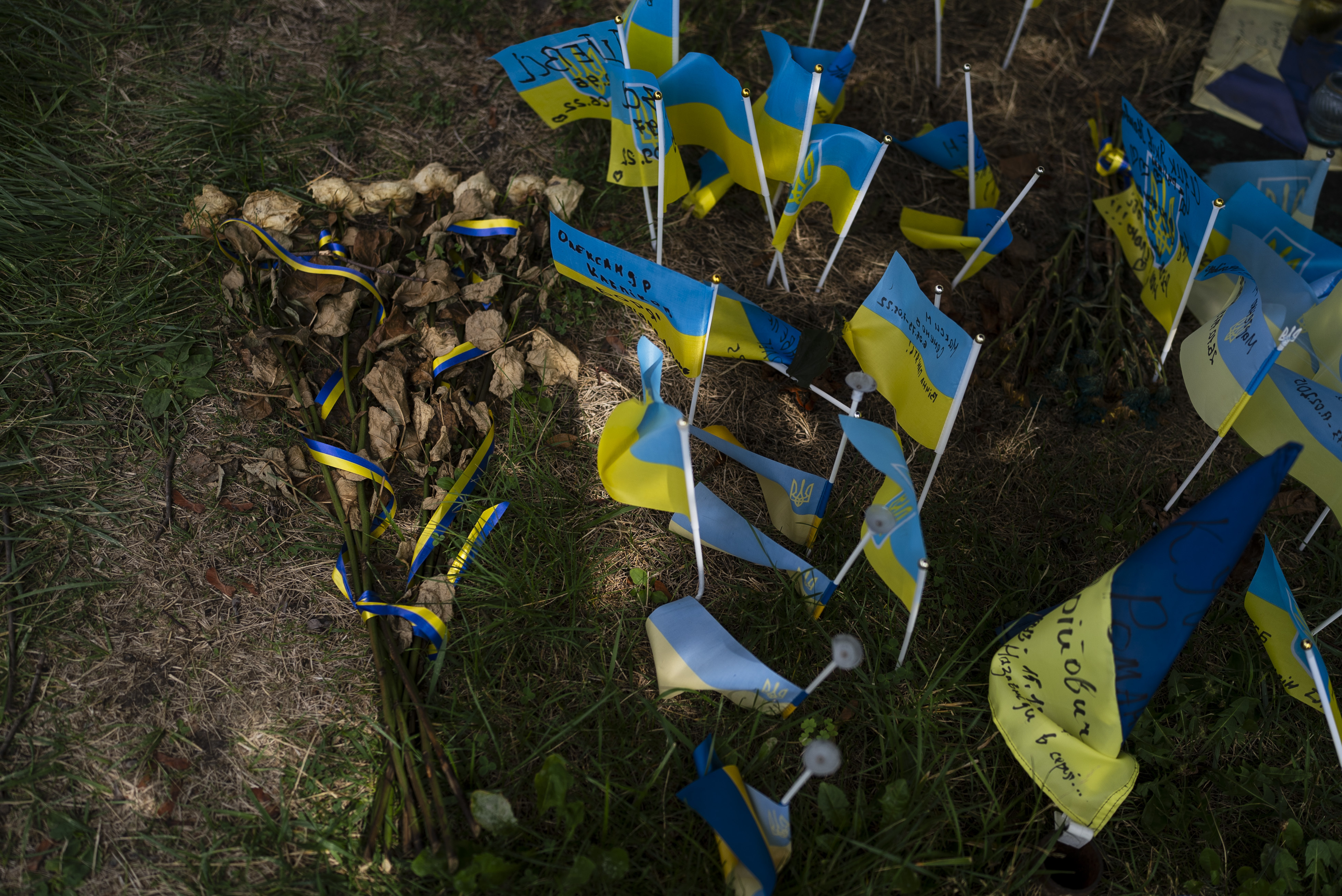 Family members and supporters gather to mark the first-year anniversary of the attack on a prison building that killed dozens. Photo / AP