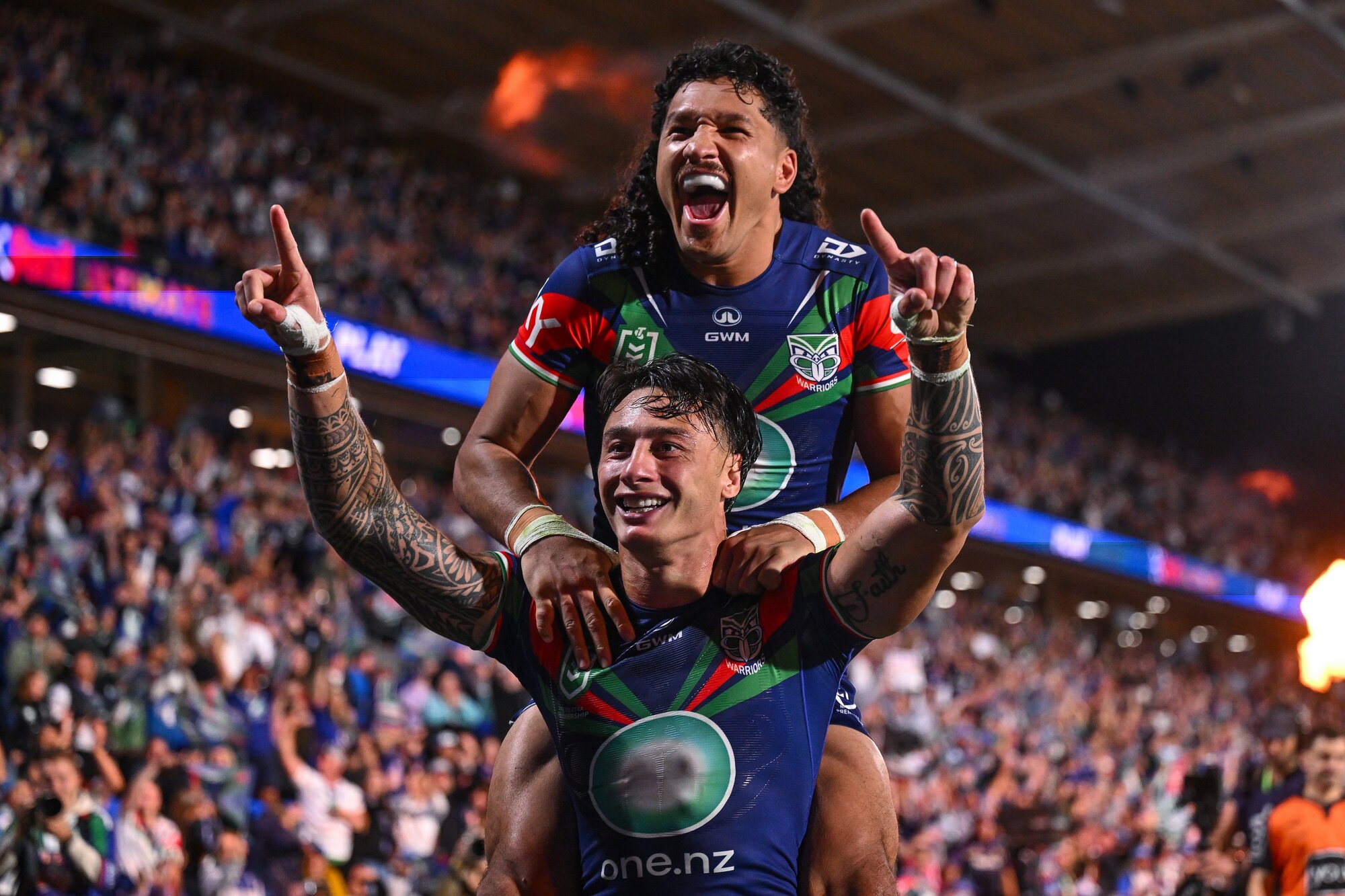 Warriors Charnze Nicoll-Klokstad and Dallin Watene-Zelezniak celebrate one of the side's many tries so far this NRL season. Photo / Photosport