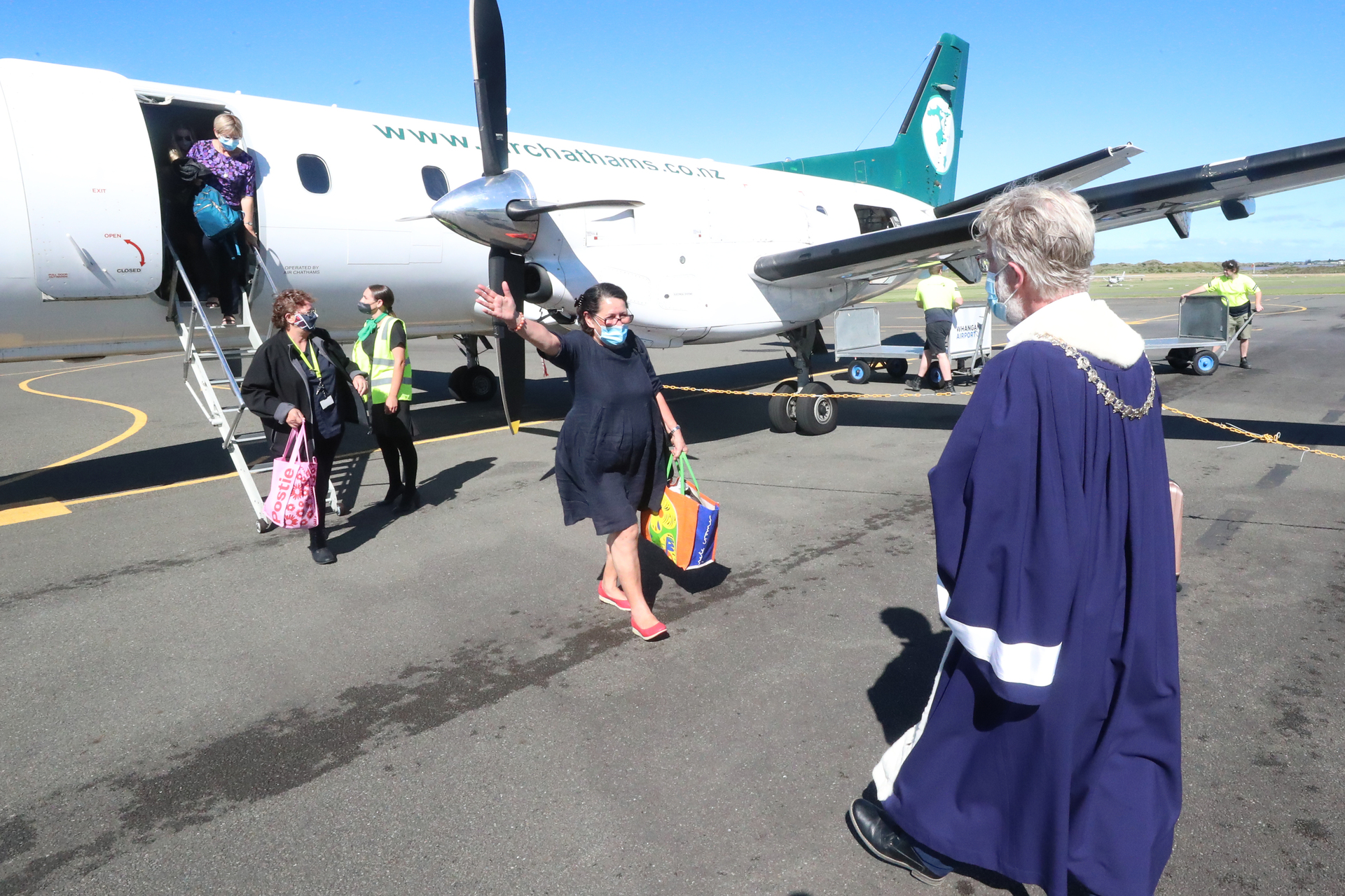 Then-Whanganui mayor Hamish McDouall greets Air Chathams passengers from Auckland in December 2021, after travel restrictions were lifted for the City of Sails. Photo / NZME