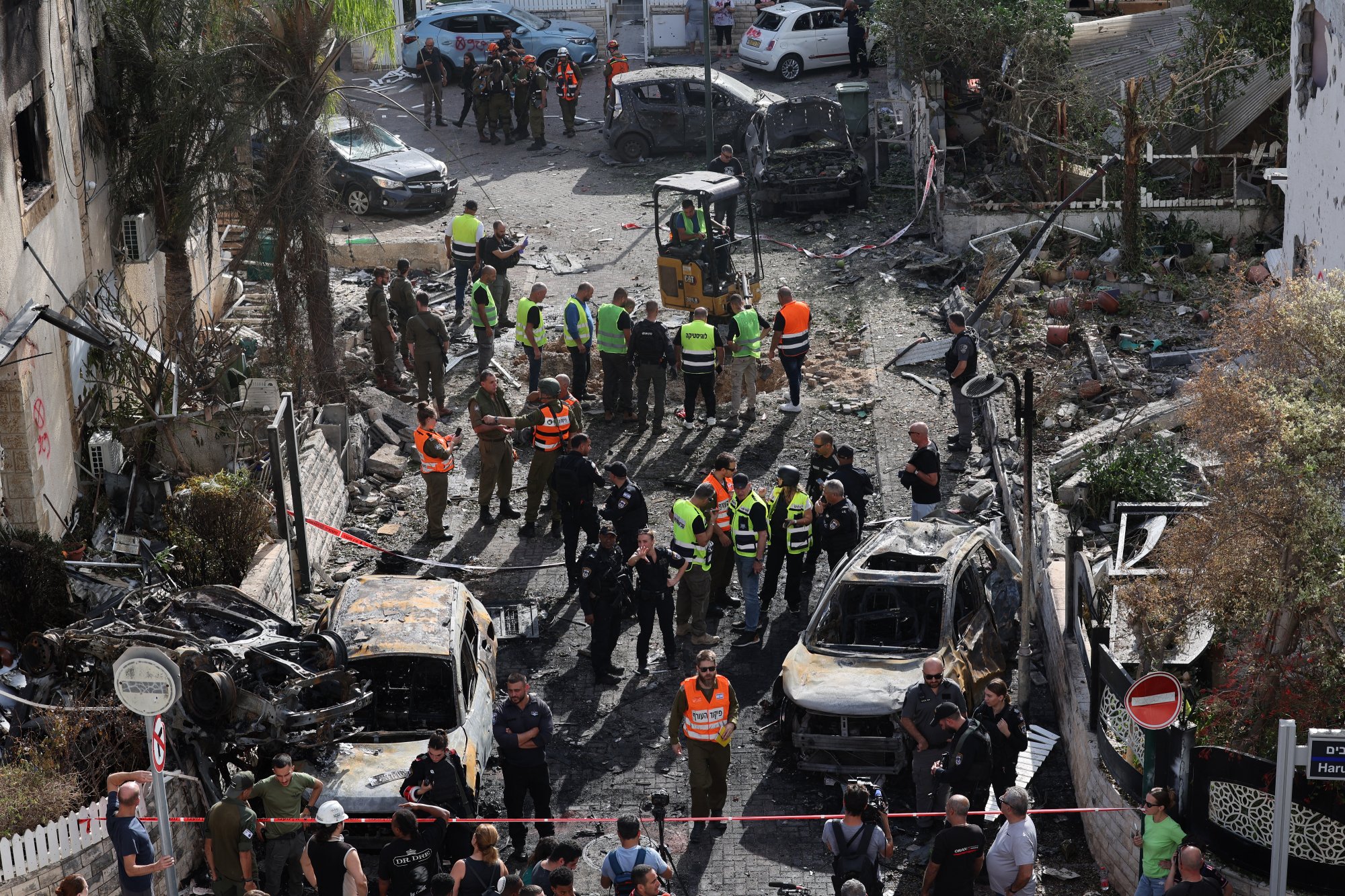 First responders and Israeli security forces gather amid debris and charred vehicles in Kiryat Bialik in the Haifa district of Israel, following a reported strike by Lebanon's Hezbollah on September 22. Photo / AFP