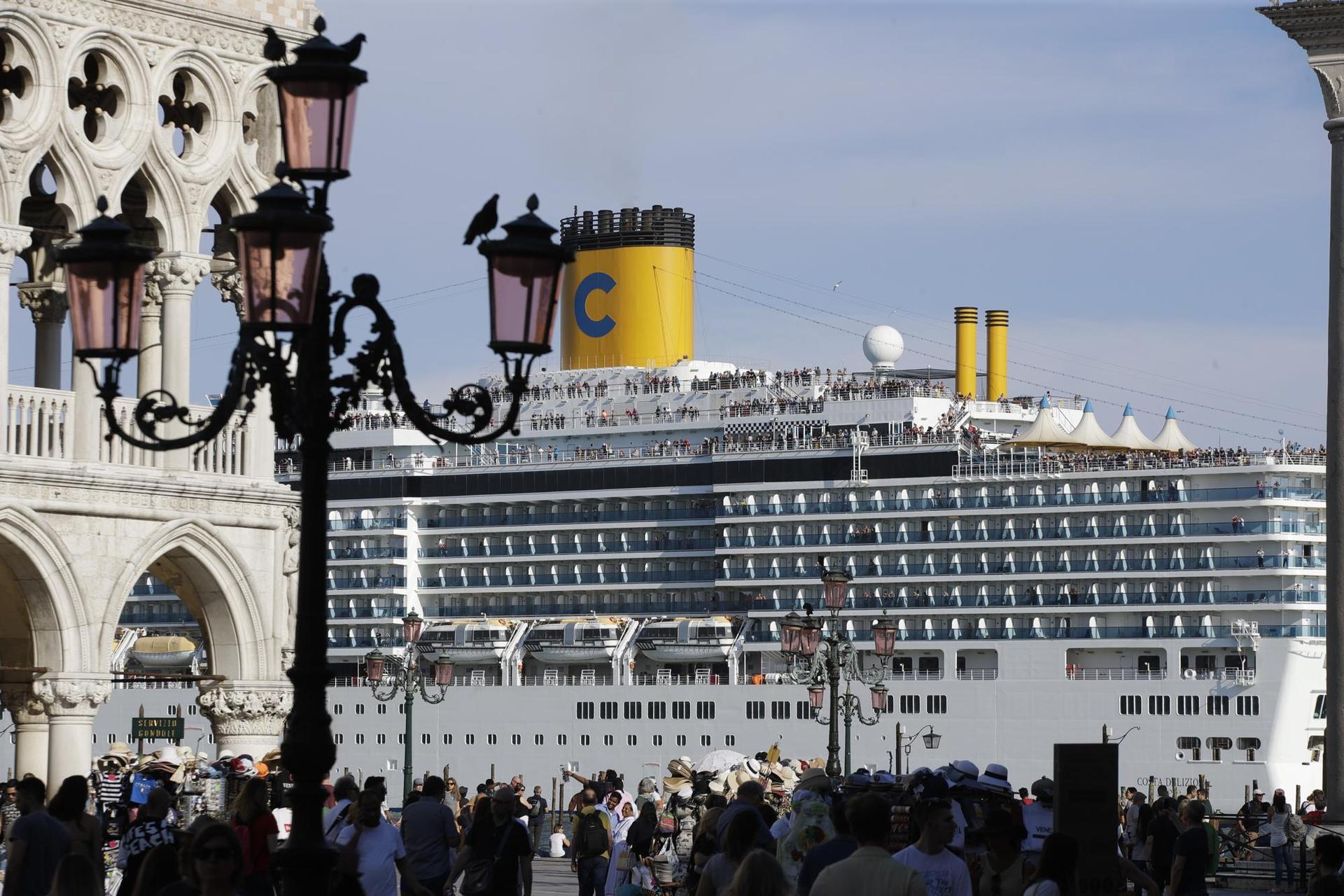A cruise ship passes by St Mark's Square filled with tourists, prior to the 2020 pause. Photo / Luca Bruno