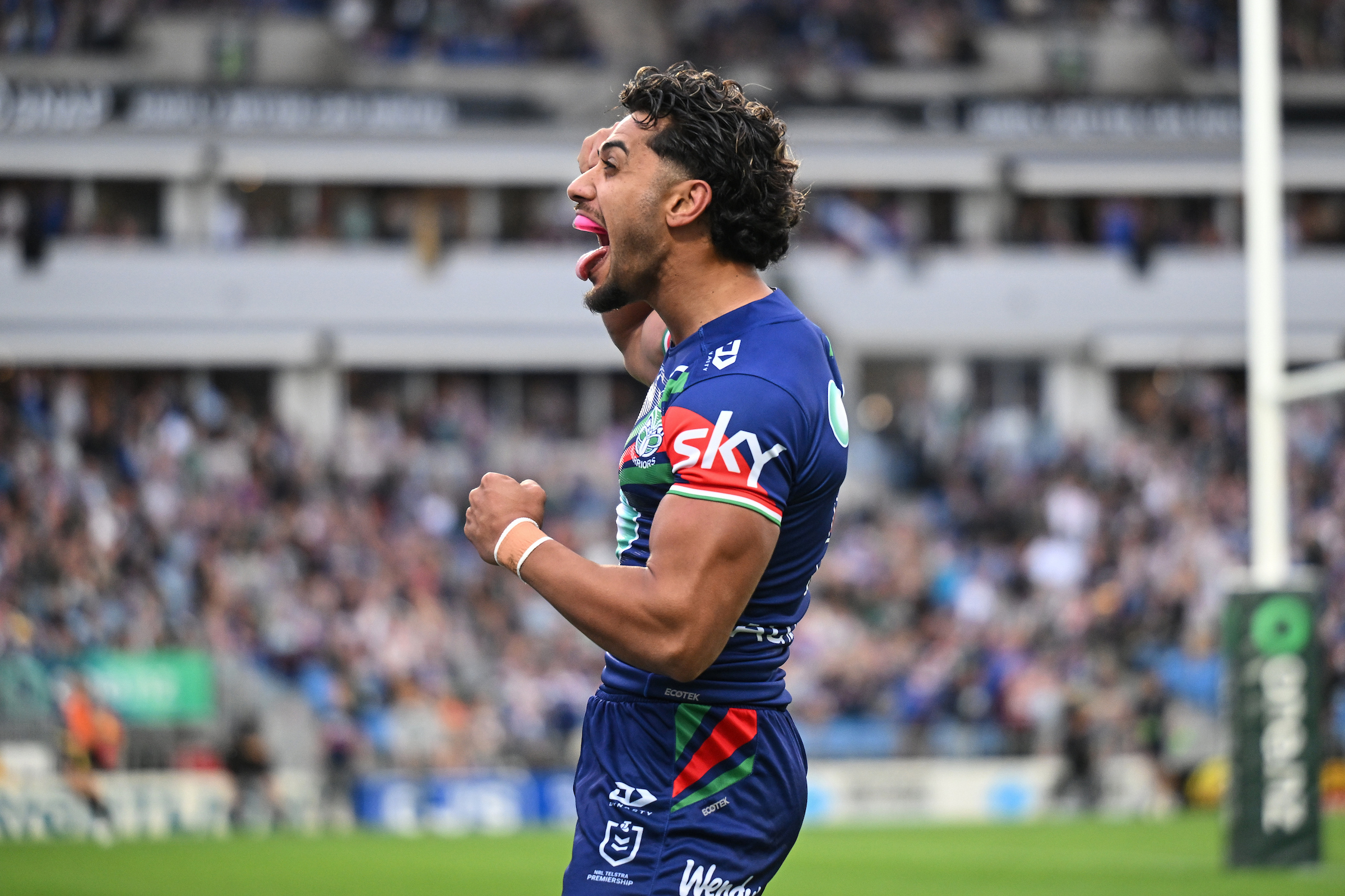 Alofiana Khan-Pereira of the Warriors celebrates a try against the Titans. Photo / Photosport