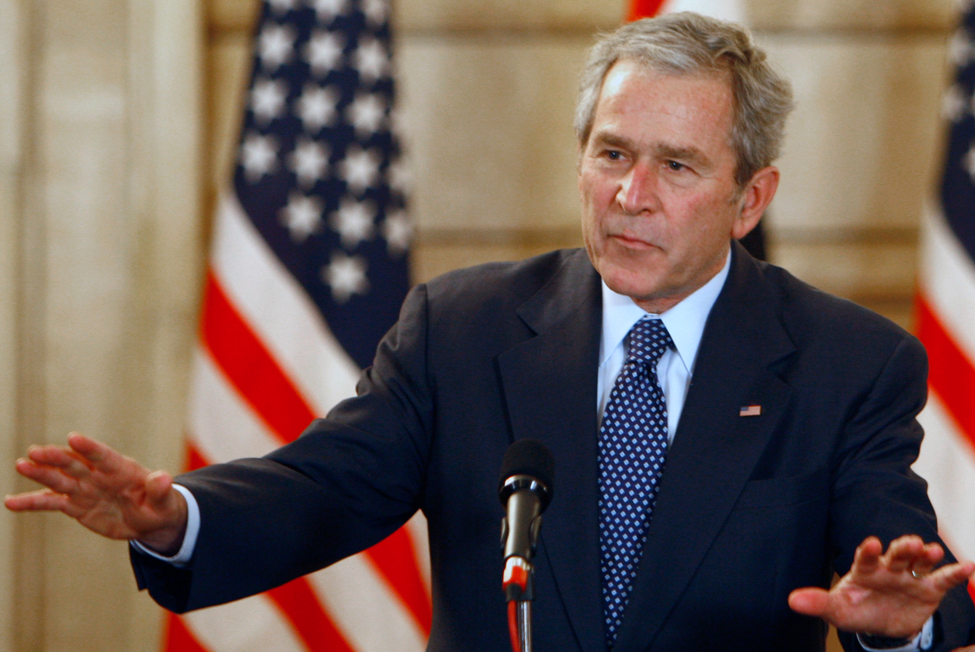 US President George W Bush reacts after shoes were thrown at him by an Iraqi journalist in Baghdad, Iraq, 2008. Photo / AP