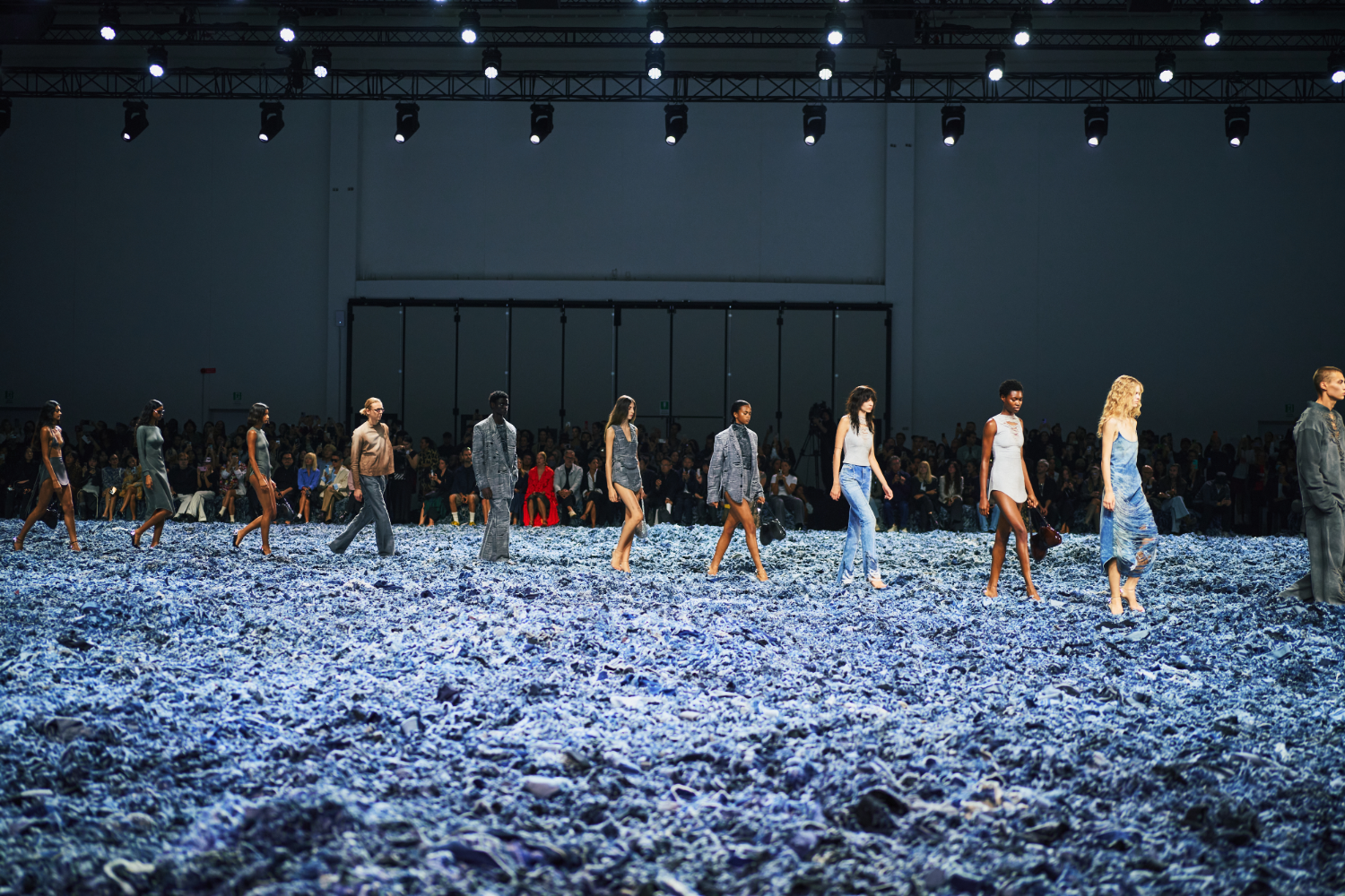 Shredded denim covered the runway at the Diesel show, making it seem as if models were walking through a blue wasteland. Photo / Simbarashe Cha for The New York Times