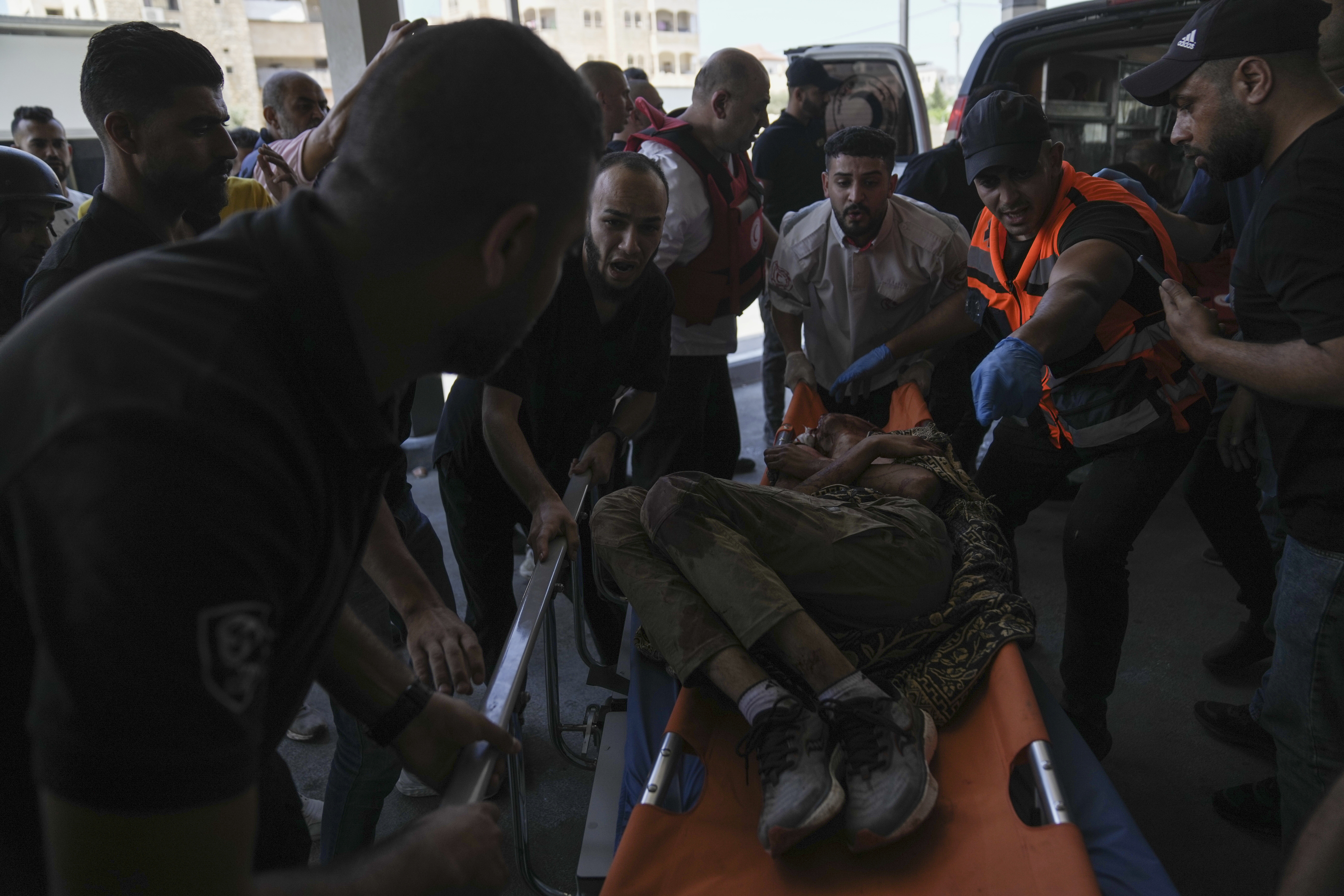 An injured Palestinian is carried into a hospital during an Israeli military raid in the Jenin refugee camp, a militant stronghold in the occupied West Bank. Photo / Nasser Nasser, AP