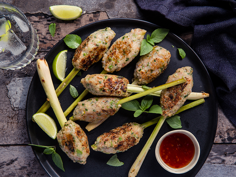 Try using lemongrass as a skewer for the delicious prawn mixture. Photo / Babiche Martens