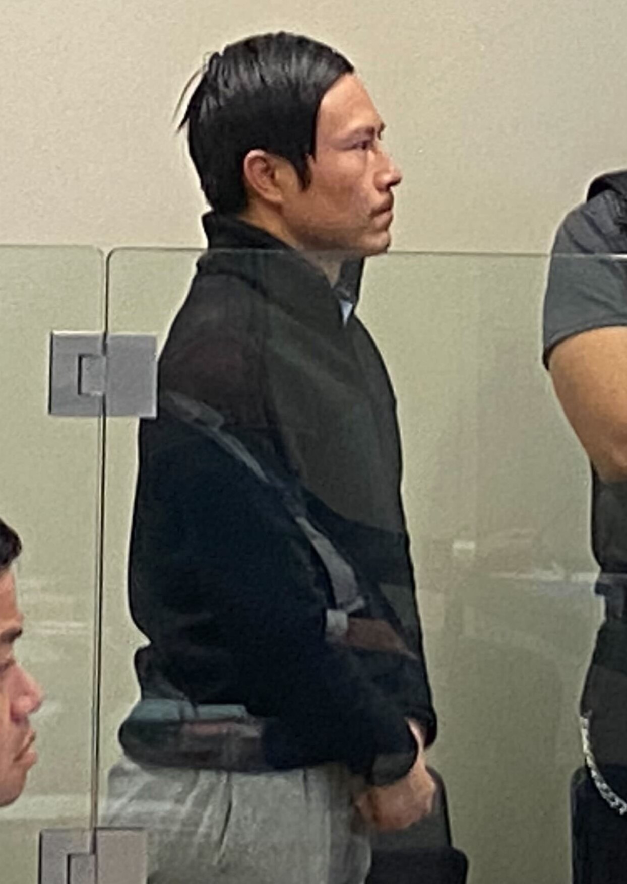 Kaixiao Liu appears in the North Shore District Court in November 2024 after he was charged with the manslaughter of Shulai Wang, whose remains were found floating off Gulf Harbour. Photo / George Block