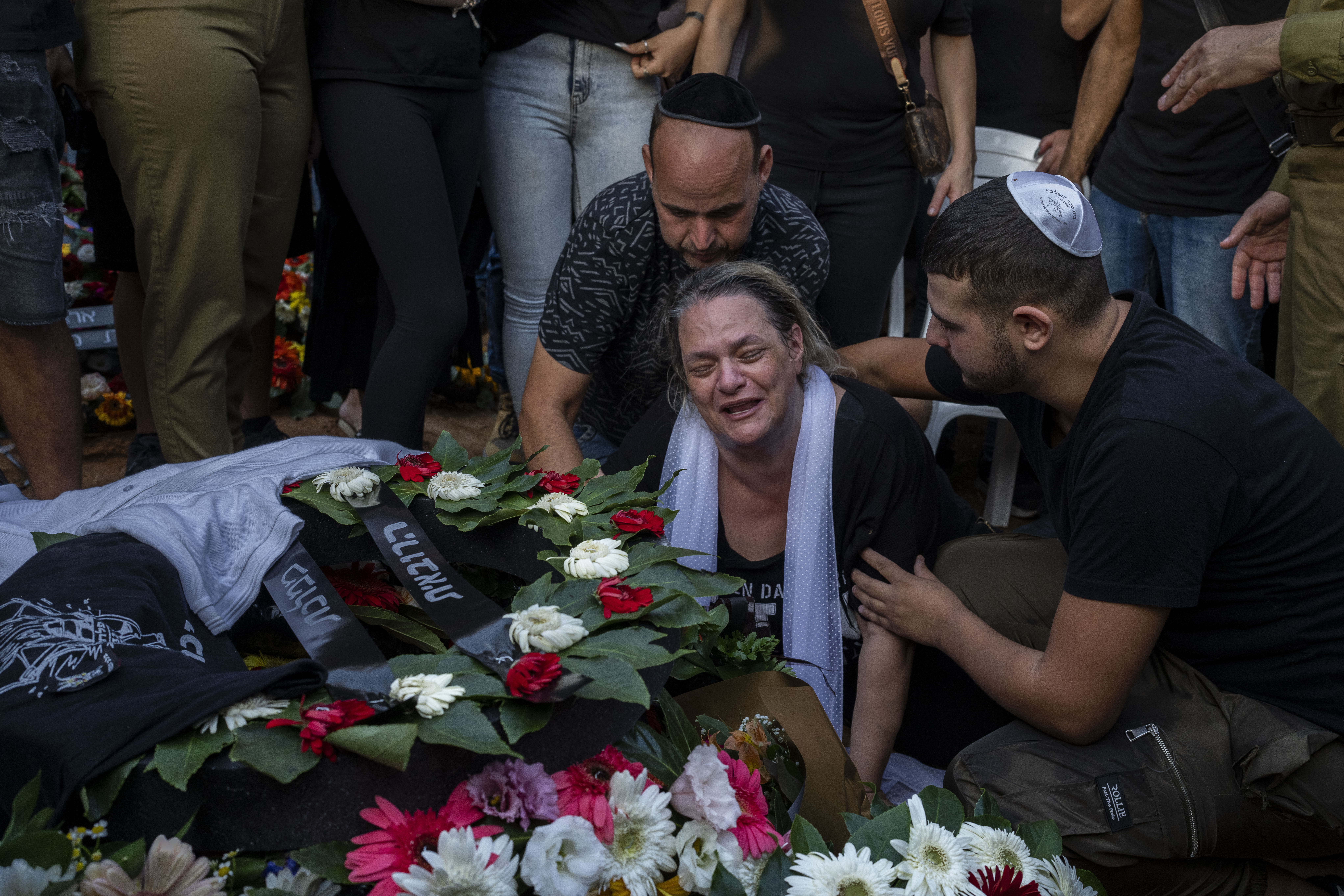 The mother of Israeli Staff Sergeant Shay Arvas mourns during her son's funeral at the Holon military cemetery, outskirts of Tel Aviv, Israel. Photo / AP
