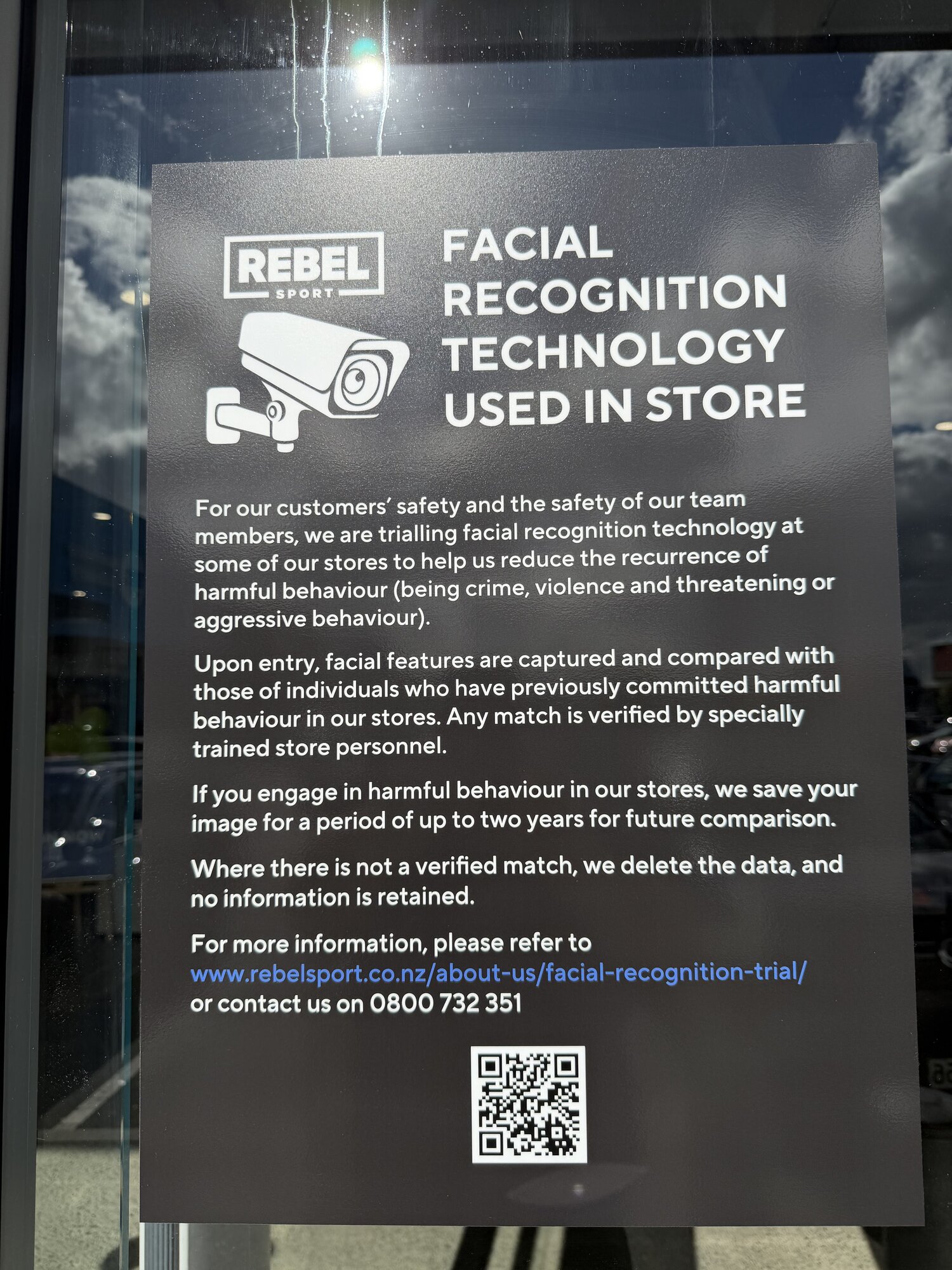 A notice outside a Rebel Sport store. Owner Briscoes is an early adopter of Auror's Subject Recognition system.