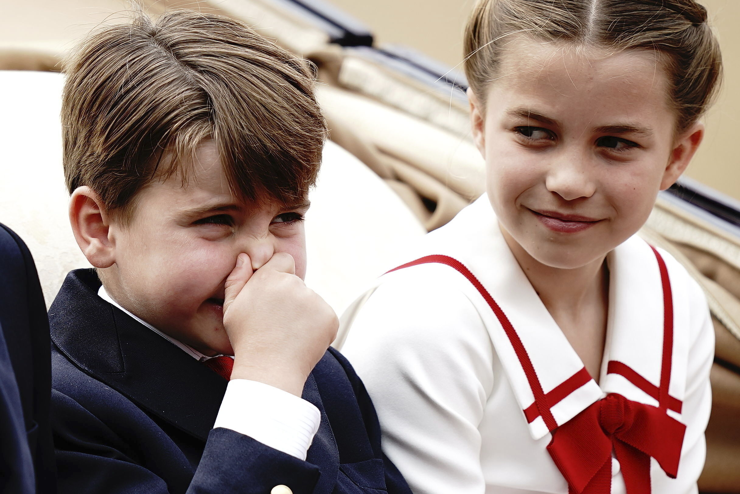 Prince Louis and Princess Charlotte during the Trooping The Colour parade. Louis reacts after allegedly catching a whiff of horse poo. Photo / AP