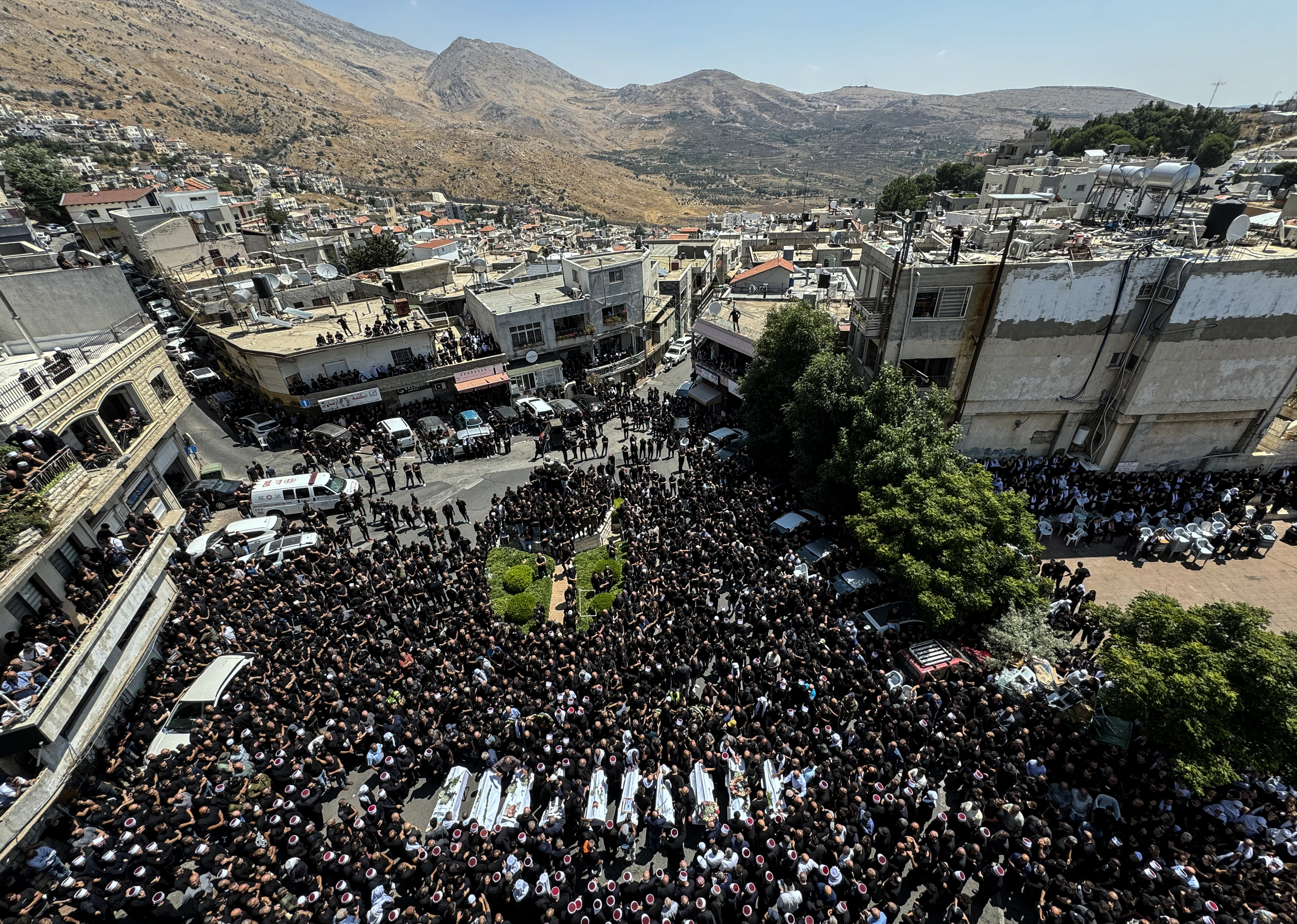 Hundreds of people from the Druze community at the funeral on Sunday of 10 people killed in a rocket attack from Lebanon in Majdal Shams, Golan Heights. Photo / Washington Post