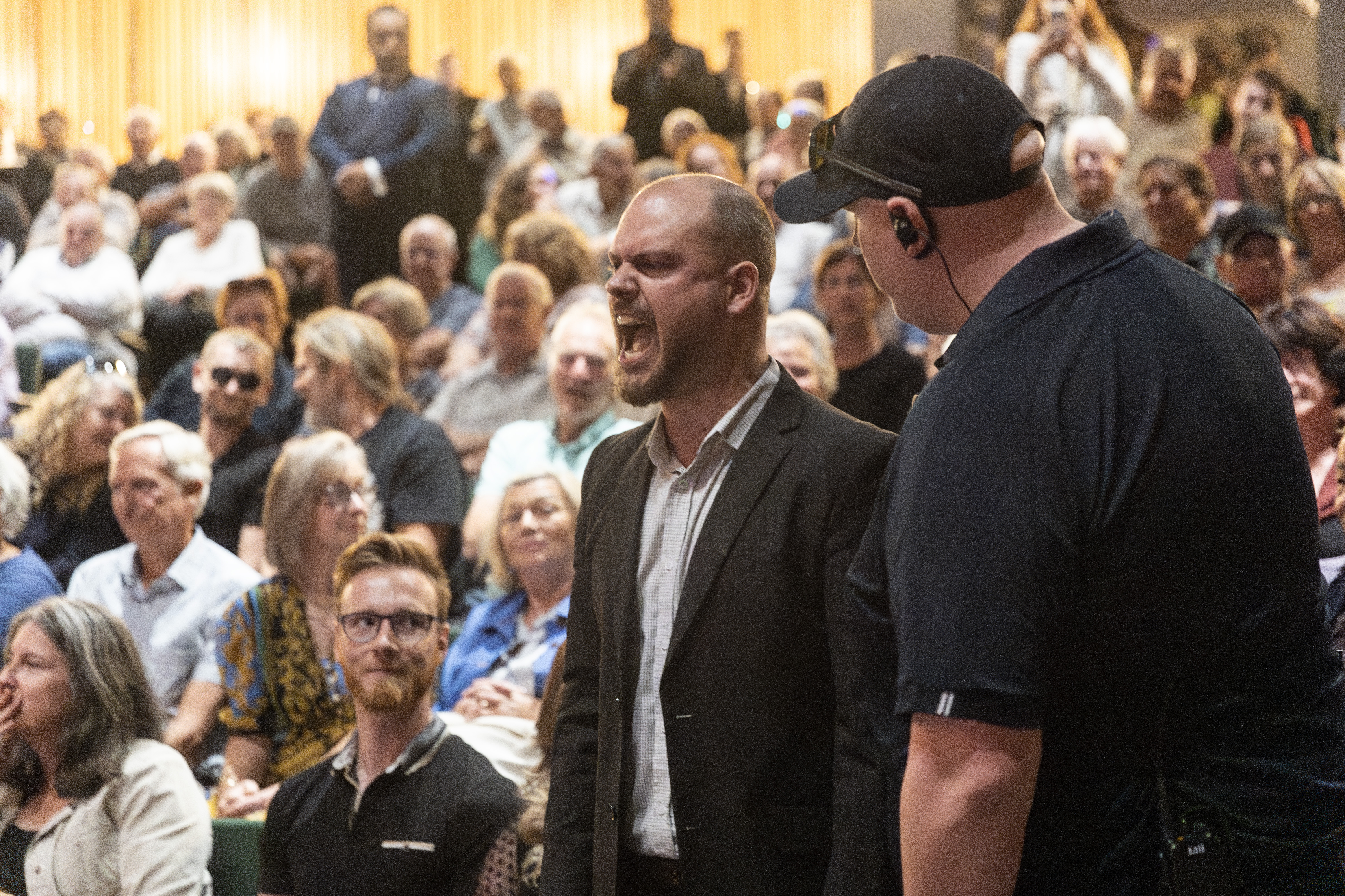 Protesters disrupt the NZ First state of the nation speech. Photo / George Heard
