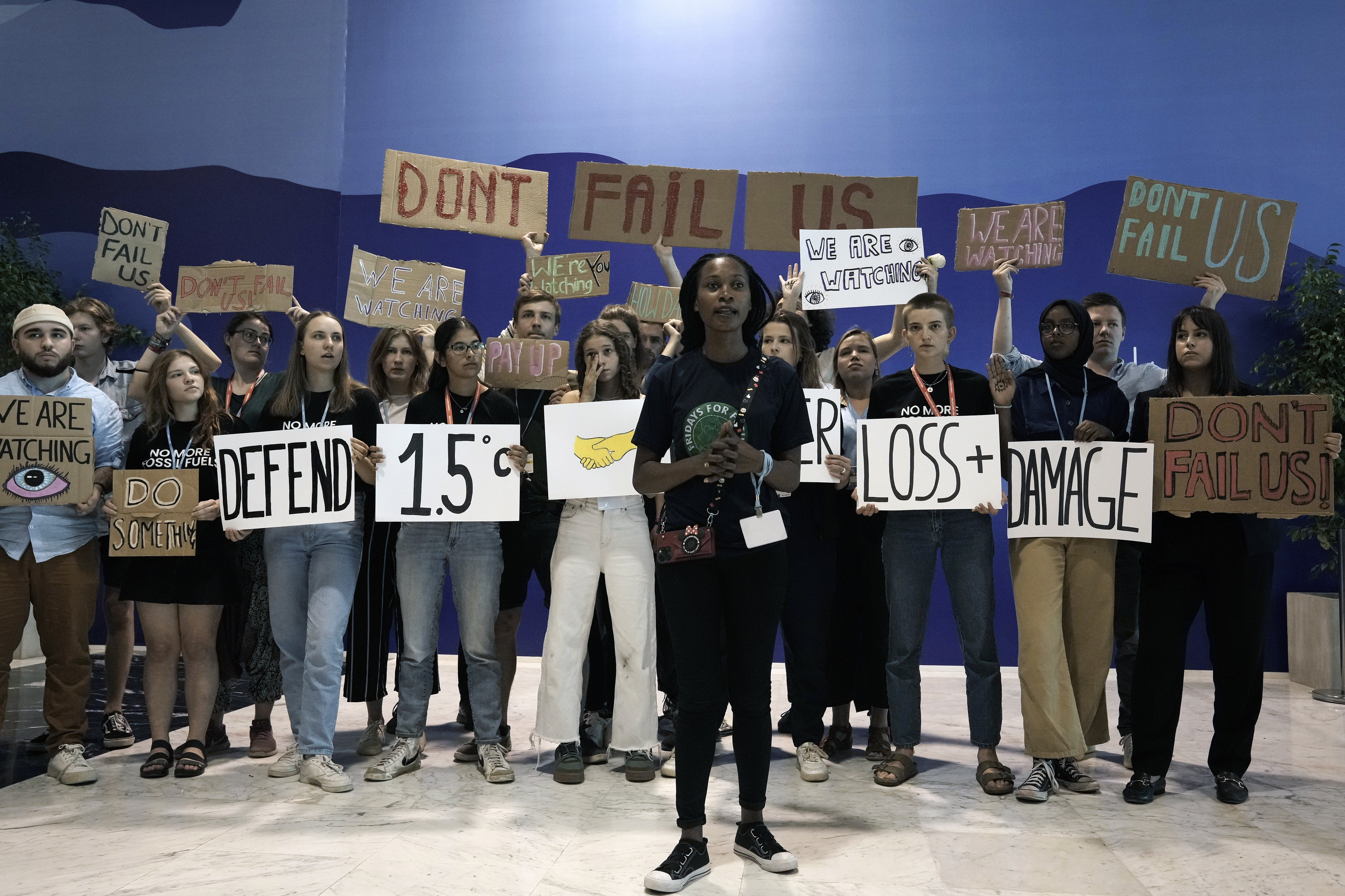 Patience Nabukalu, from Uganda, with fellow climate activists at the United Nation's COP27 summit in Egypt, 2022. Photo / AP