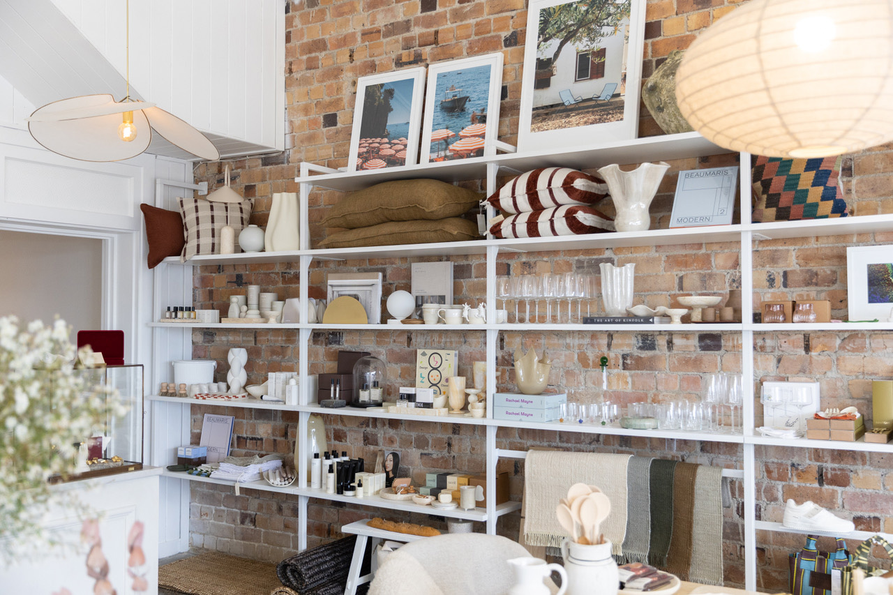 The purpose-built shelves display a wide range of homeware, art, linens and beauty products. Photo / Skye Carter