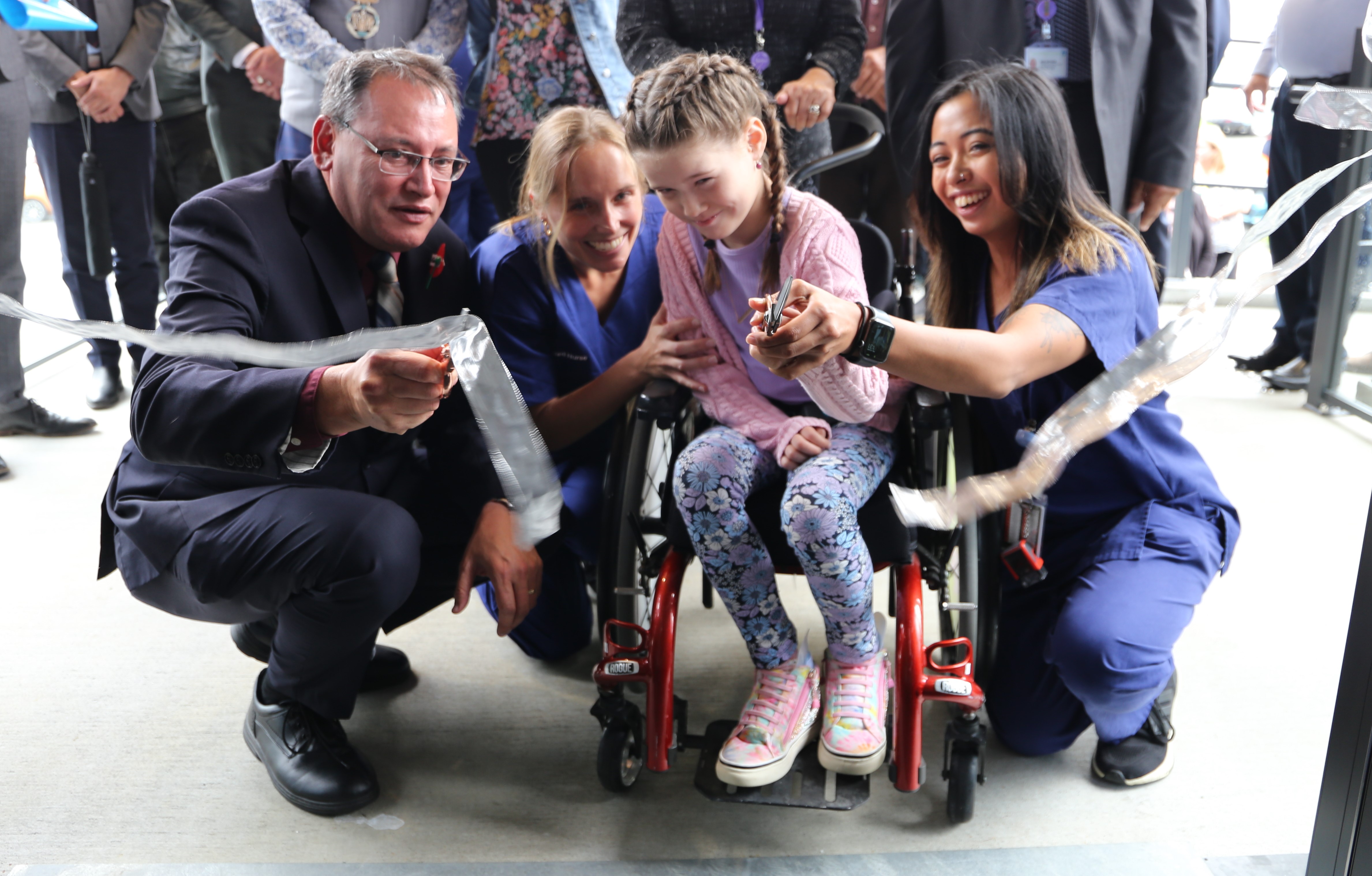 From left: Minister of Health Dr Shane Reti, registered nurse Edhen Church, Mackenzie Campbell, 10, and registered nurse Joiemaia Lubrica combine to open the new facility.