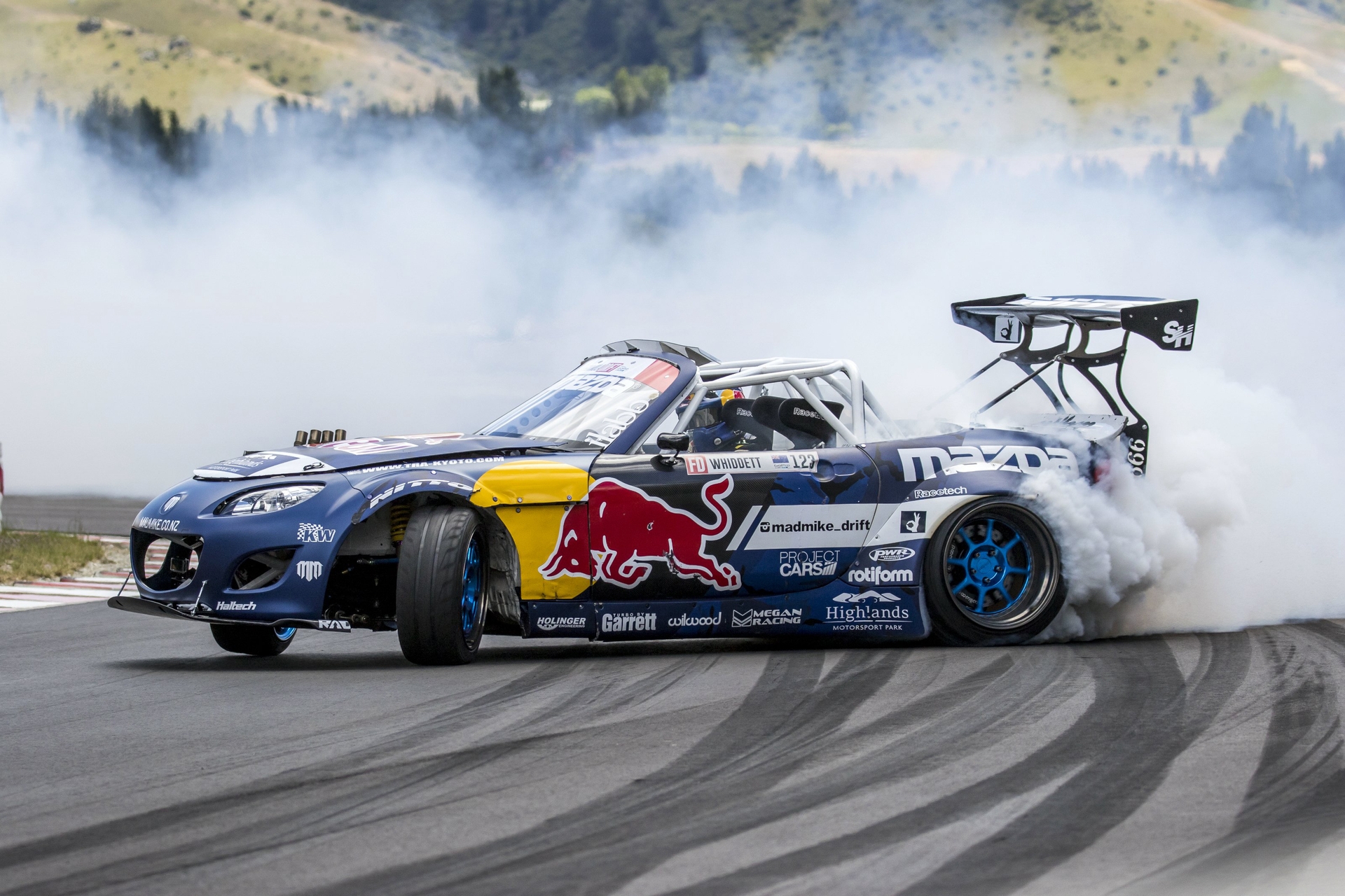 Mad Mike Whiddett drifting his Red Bull Mazda