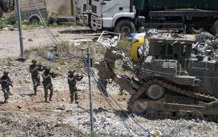 Israeli soliders aim their weapons during a military operation in the town of Deir al-Ghusun, near the West Bank town of Tulkarem, Saturday, May 4, 2024. Photo / AP