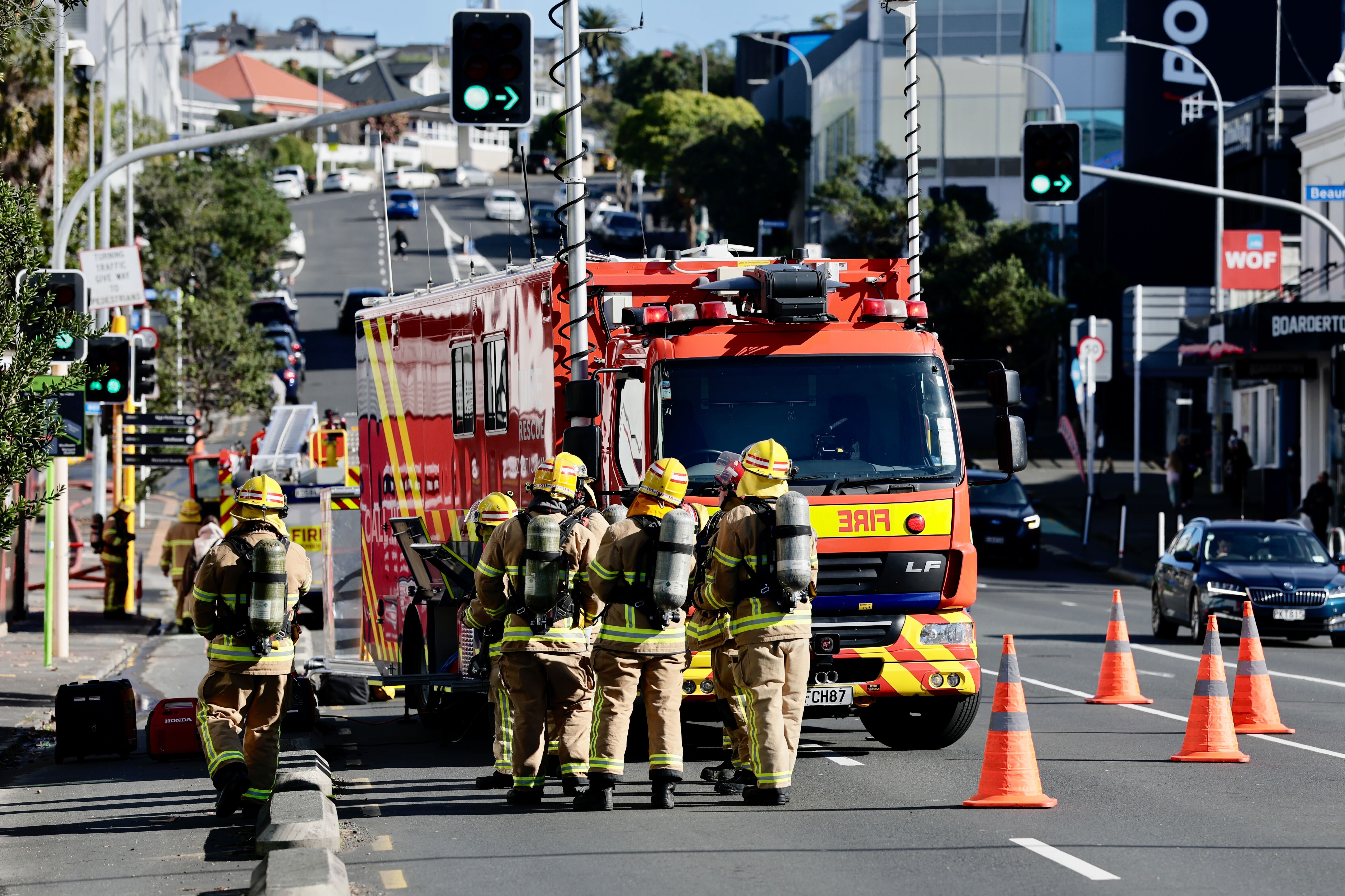 Firefighters at the scene of the New World, Victoria Park fire. Photo / Dean Purcell