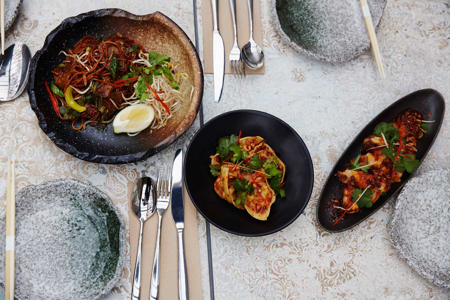 Left to right, noodles with pork, dumplings with prawn, eggplant chips. Photo / Rebecca Zephyr Thomas